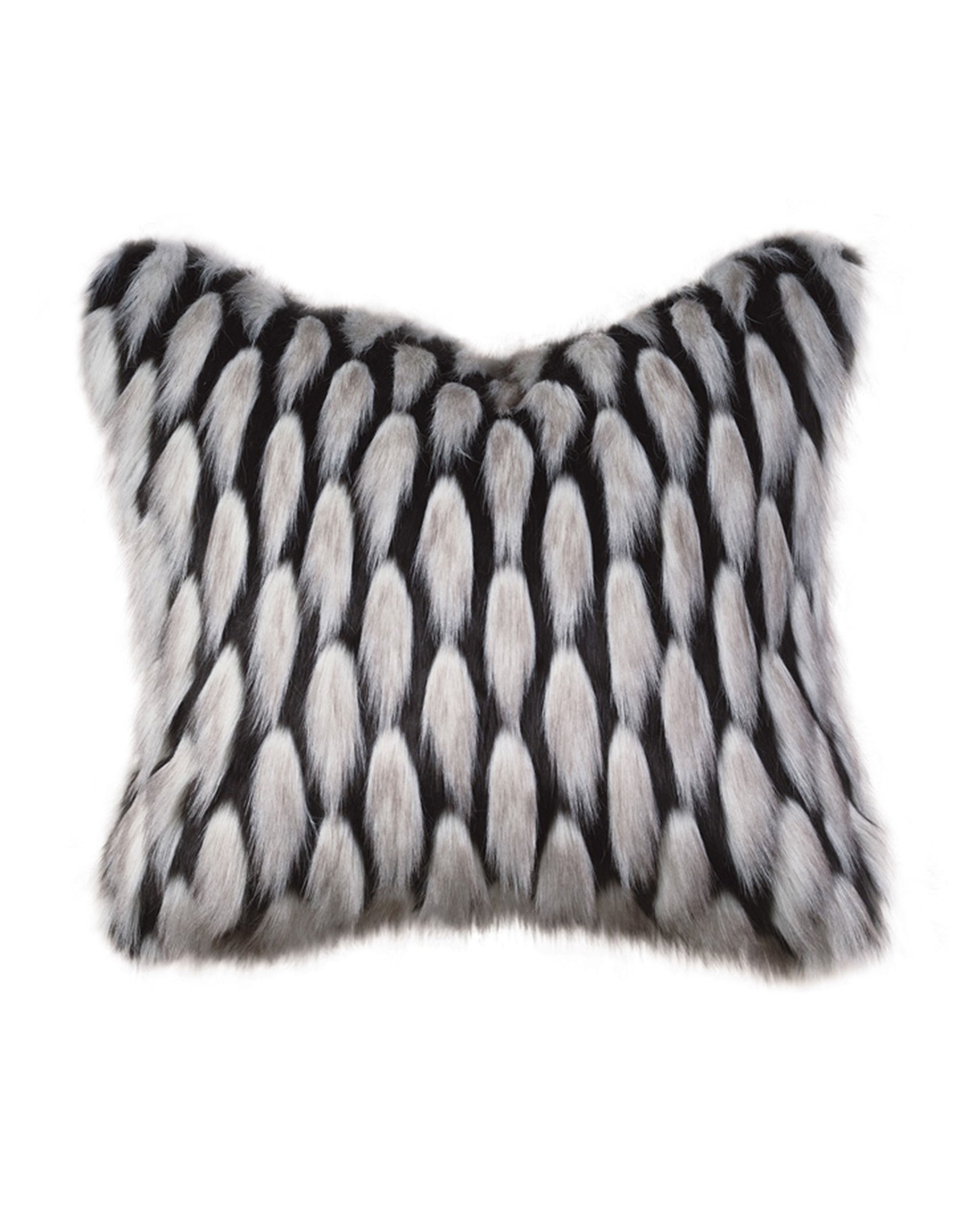 The JADIS ONYX pillow by Eastern Accents is a rectangular decorative accent, featuring soft, fluffy faux fur in a black and white animal-inspired spotted pattern for a chic, luxurious touch to any room.