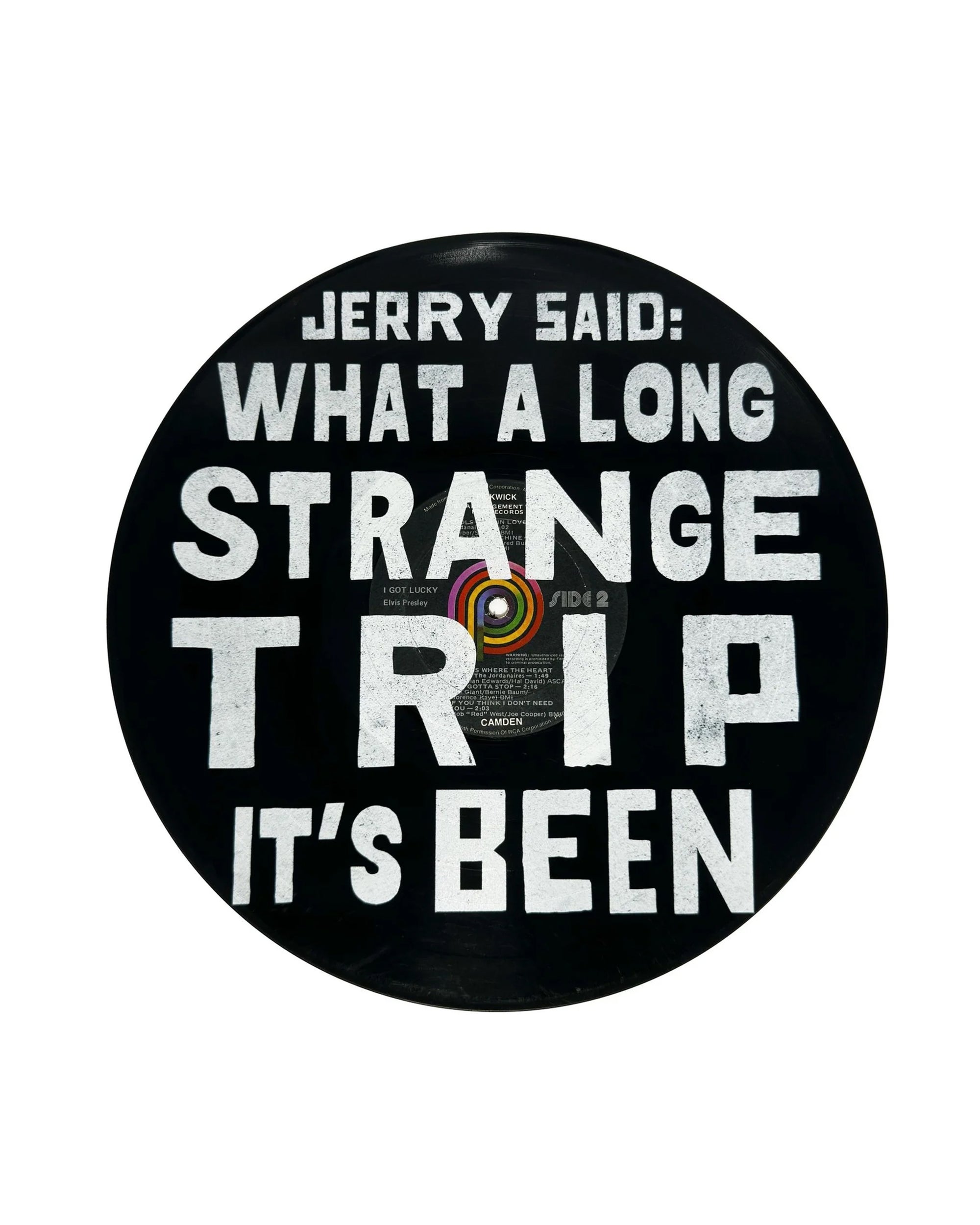 The Jerry Said Vinyl Record by Sugarboo Designs features bold white text—“Jerry said: What a long strange trip it’s been.”—on black vinyl, making a unique wall decor piece with visible label and grooves.