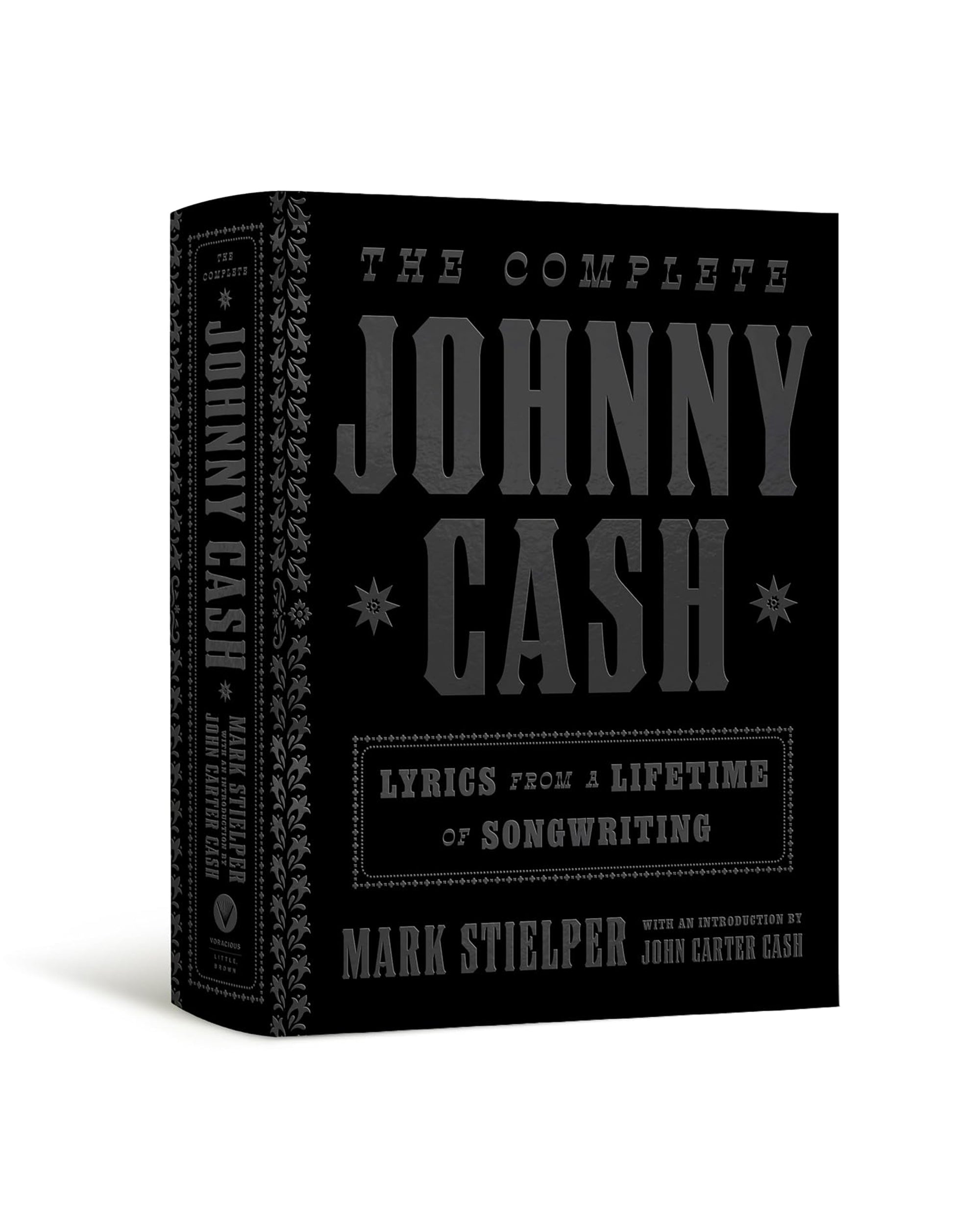 The Complete Johnny Cash by Hachette Book Group features bold embossing and an introduction by John Carter Cash—a black hardcover archive of iconic lyrics curated by Mark Stielper.