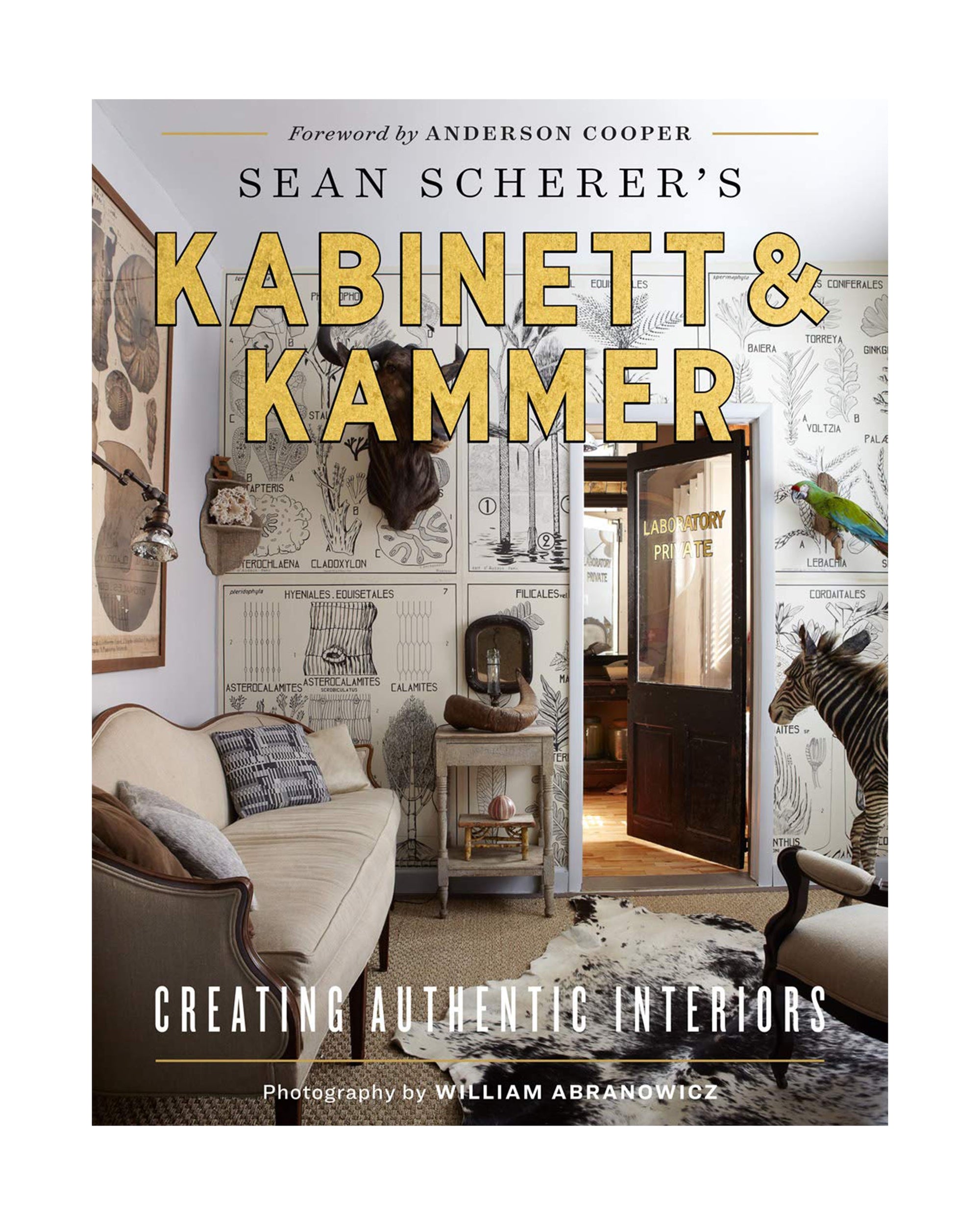 Cover of "Sean Scherer's Kabinett" by Hachette Book Group, showcasing an eclectic living room with vintage finds, animal decor, and illustrated wallpaper—perfect for interior design fans. Features a foreword by Anderson Cooper.
