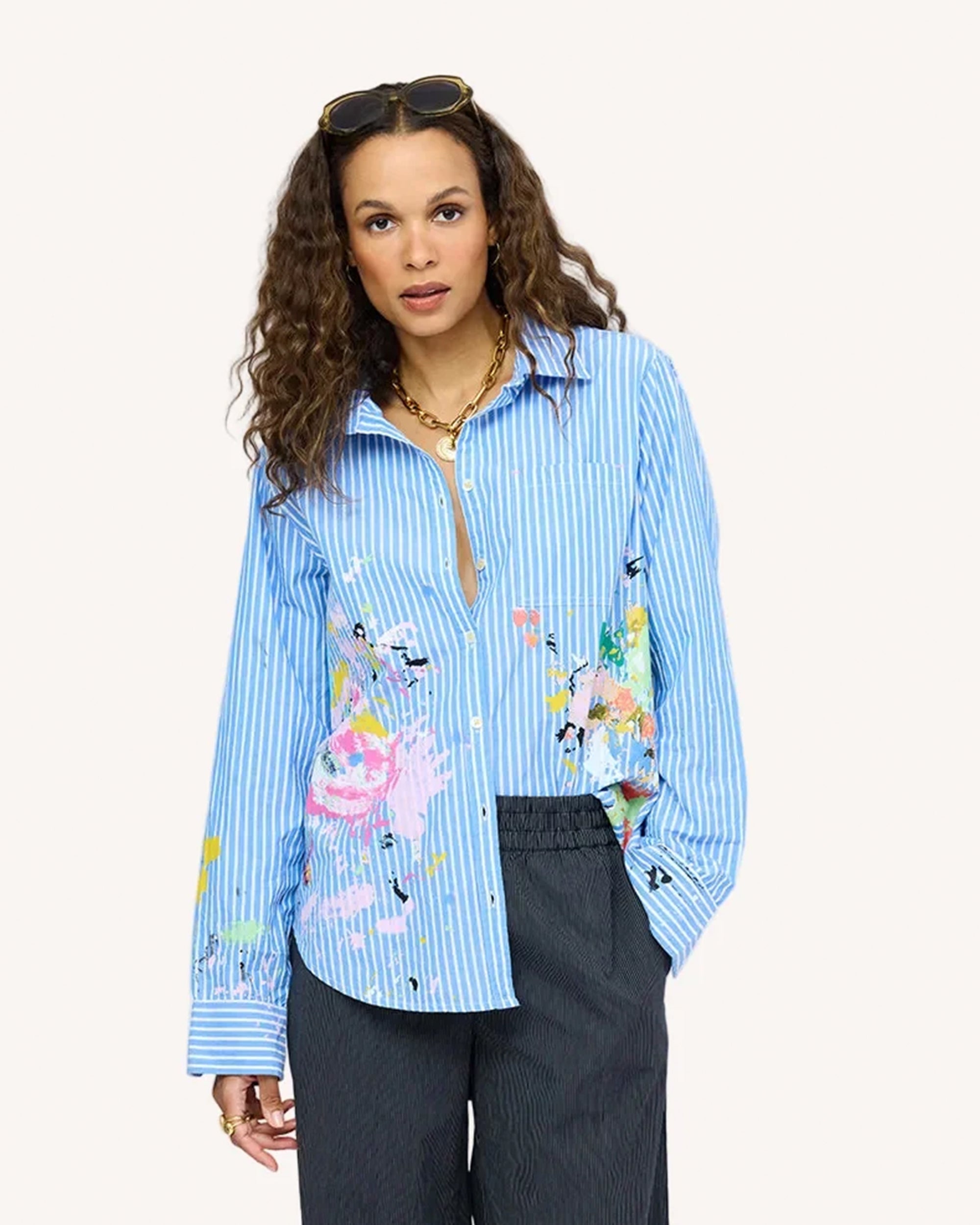 Blue striped Kerri Rosenthal Mia Happimess shirt styled with gray pants and gold necklace, casual modern look.
