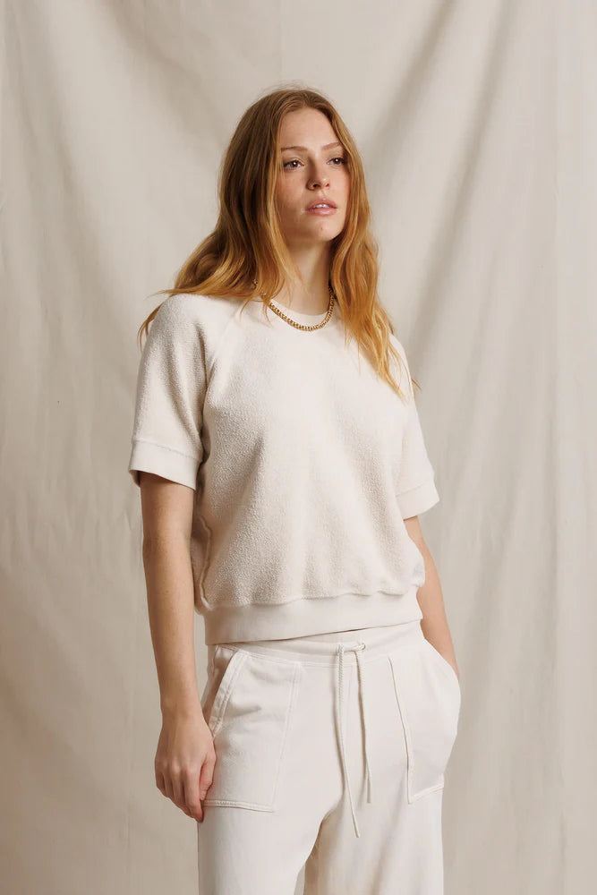 Cream Perfectwhitetee Kennedy SS Crew Sweatshirt and joggers, relaxed fit, styled against a beige fabric backdrop.