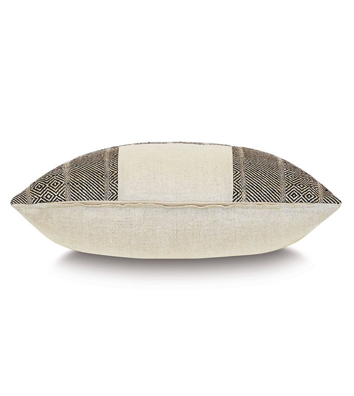 The KIMAHRI PATCHWORK by Eastern Accents is a rectangular beige linen throw pillow featuring black geometric patterns on both sides, shown against a white backdrop. This pillow offers a soft and plush decorative touch.