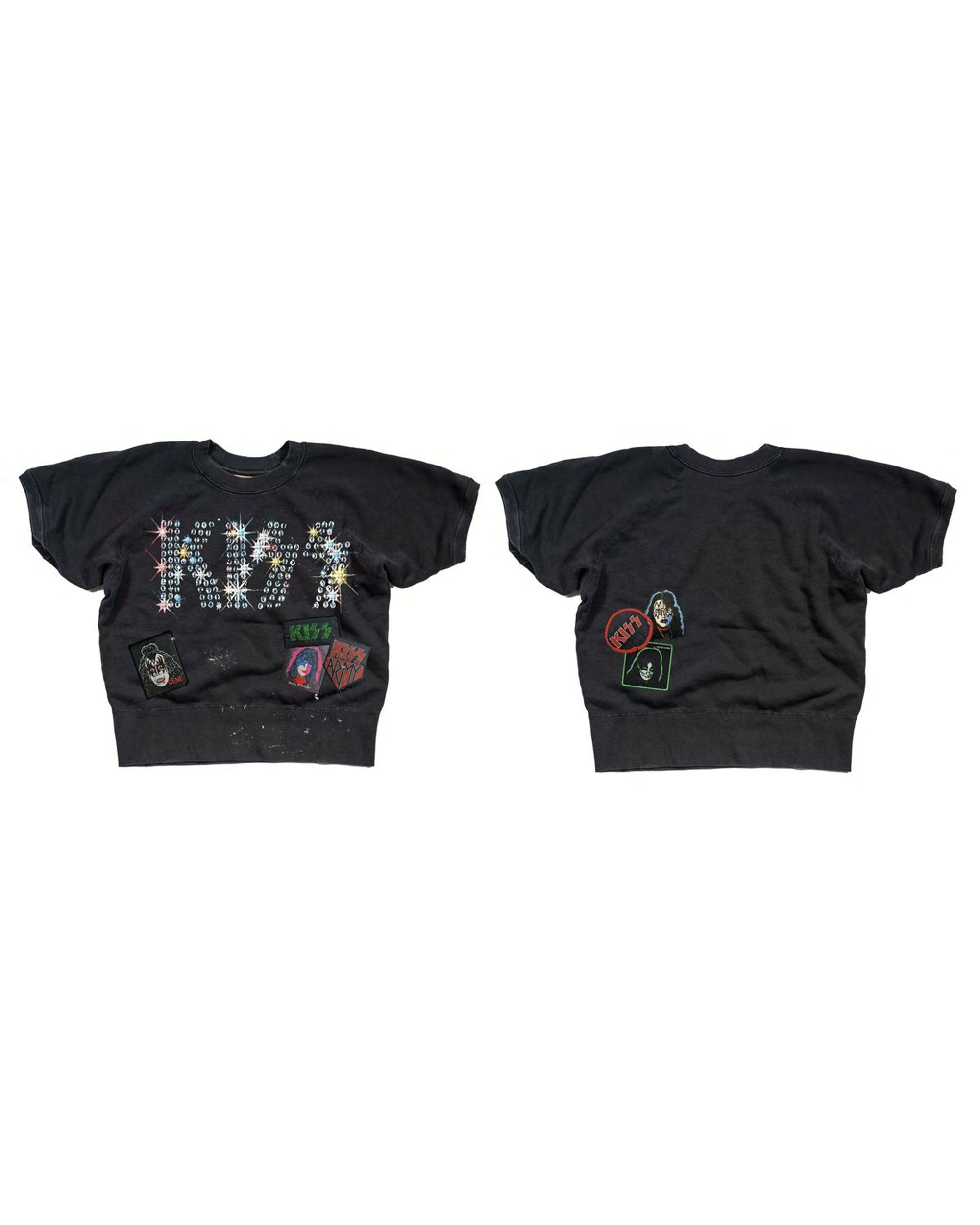 Black cropped sweatshirt with colorful Kiss logos and patches by Made Worn for a bold rock-inspired look.