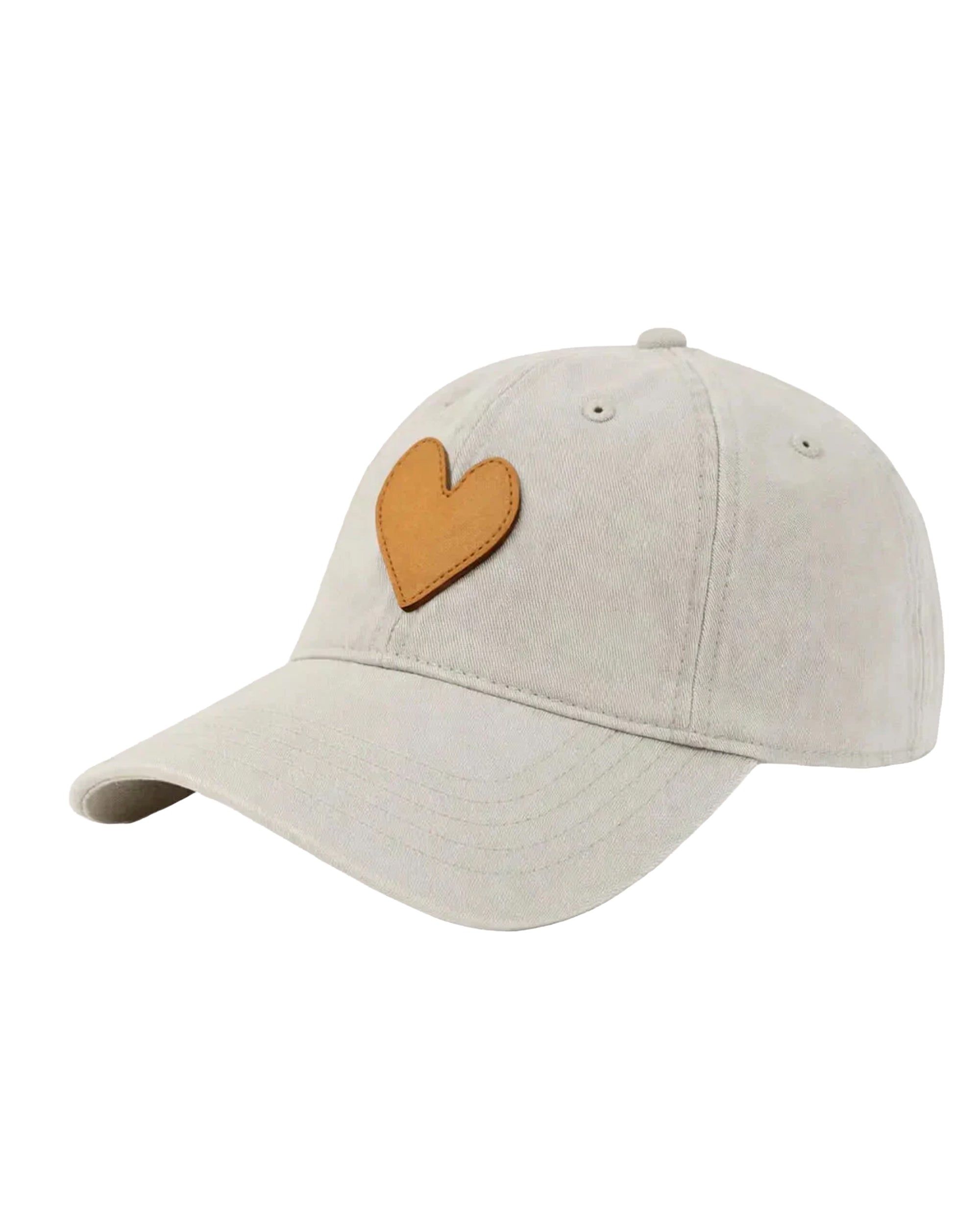 The KR Leather Heart Hat by Kerri Rosenthal is a light beige cotton-twill hat with a brown, heart-shaped leather patch on the front. This adjustable cap is part of the Imperfect Heart Hat collection.
