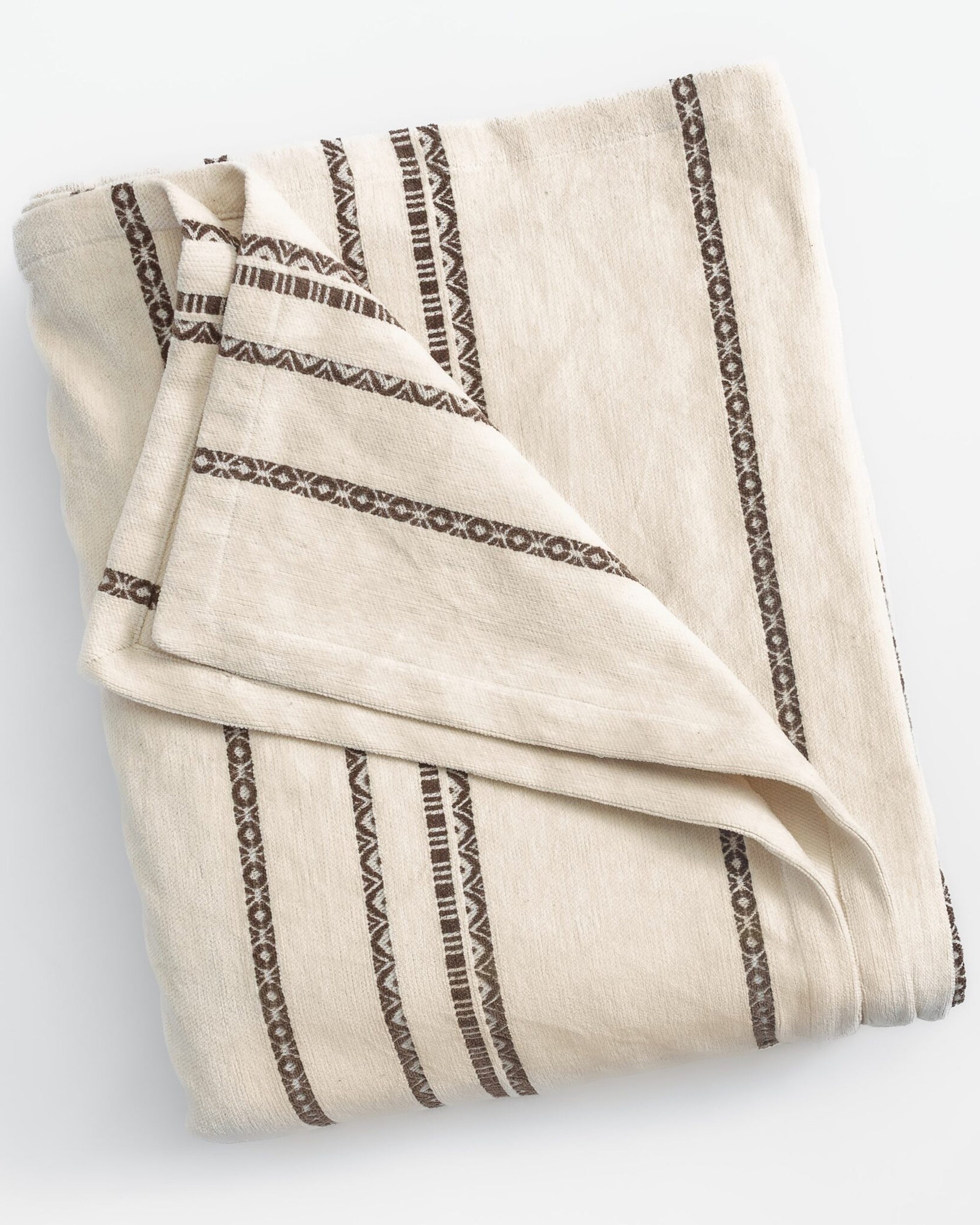 Cream chenille coverlet with brown geometric stripes by Amity Home, Larkin collection, on a white background.