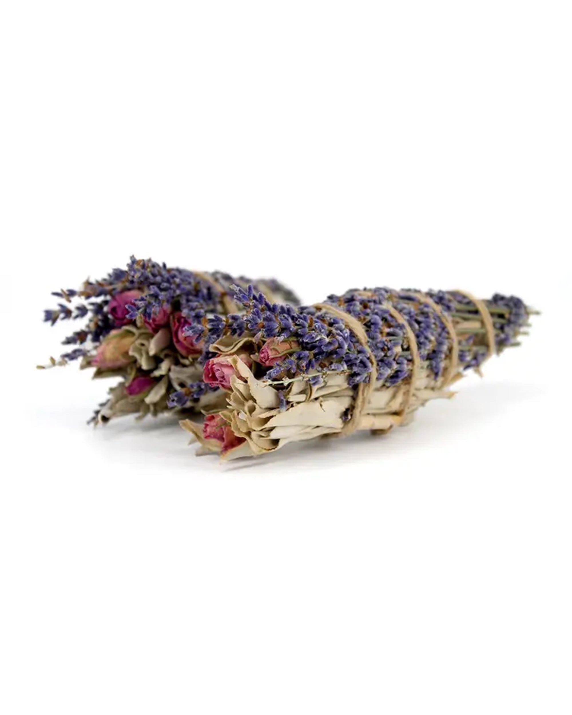 The Faire Lavender, Sage and Rose Smudge features dried sage, lavender, and rose tied with twine—an ideal choice for gentle cleansing rituals.