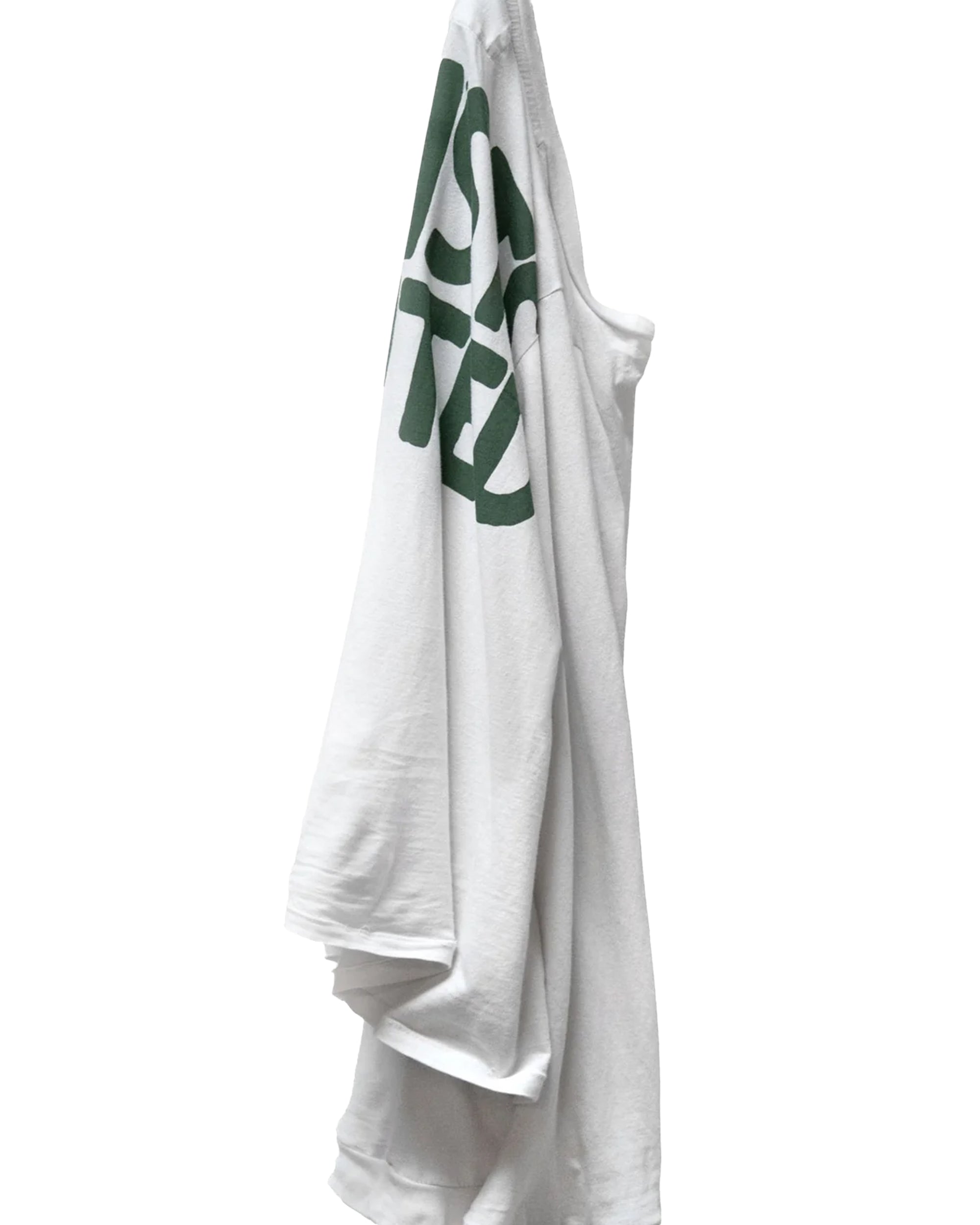 White long sleeve tee with green text by Free City, Artistwanted Tubular style, displayed on a hook against white background.