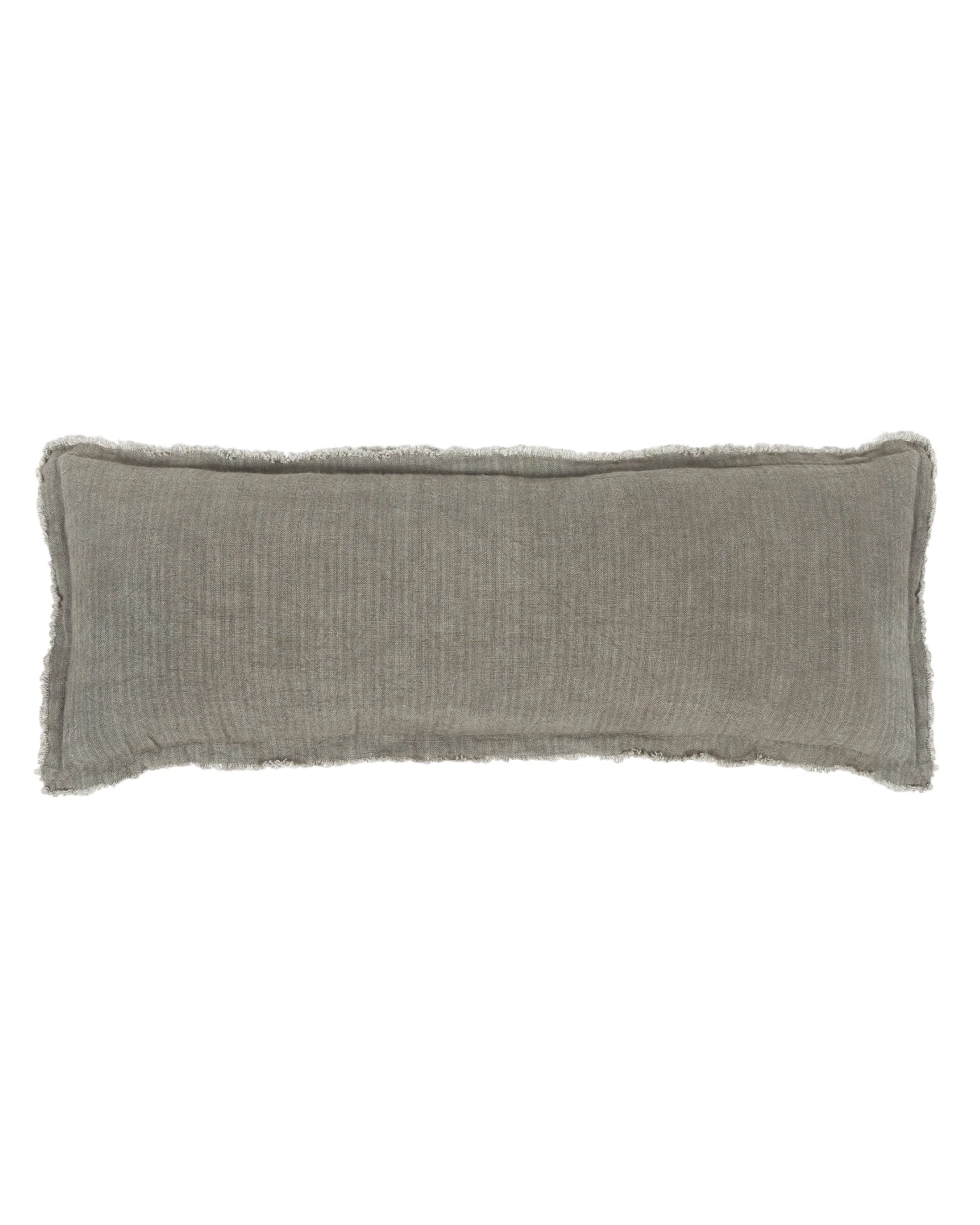 The Laurel Big Pillow by POM POM is a rectangular olive green cushion made from soft stonewashed linen with a loomed texture and frayed edges, displayed on a white background.