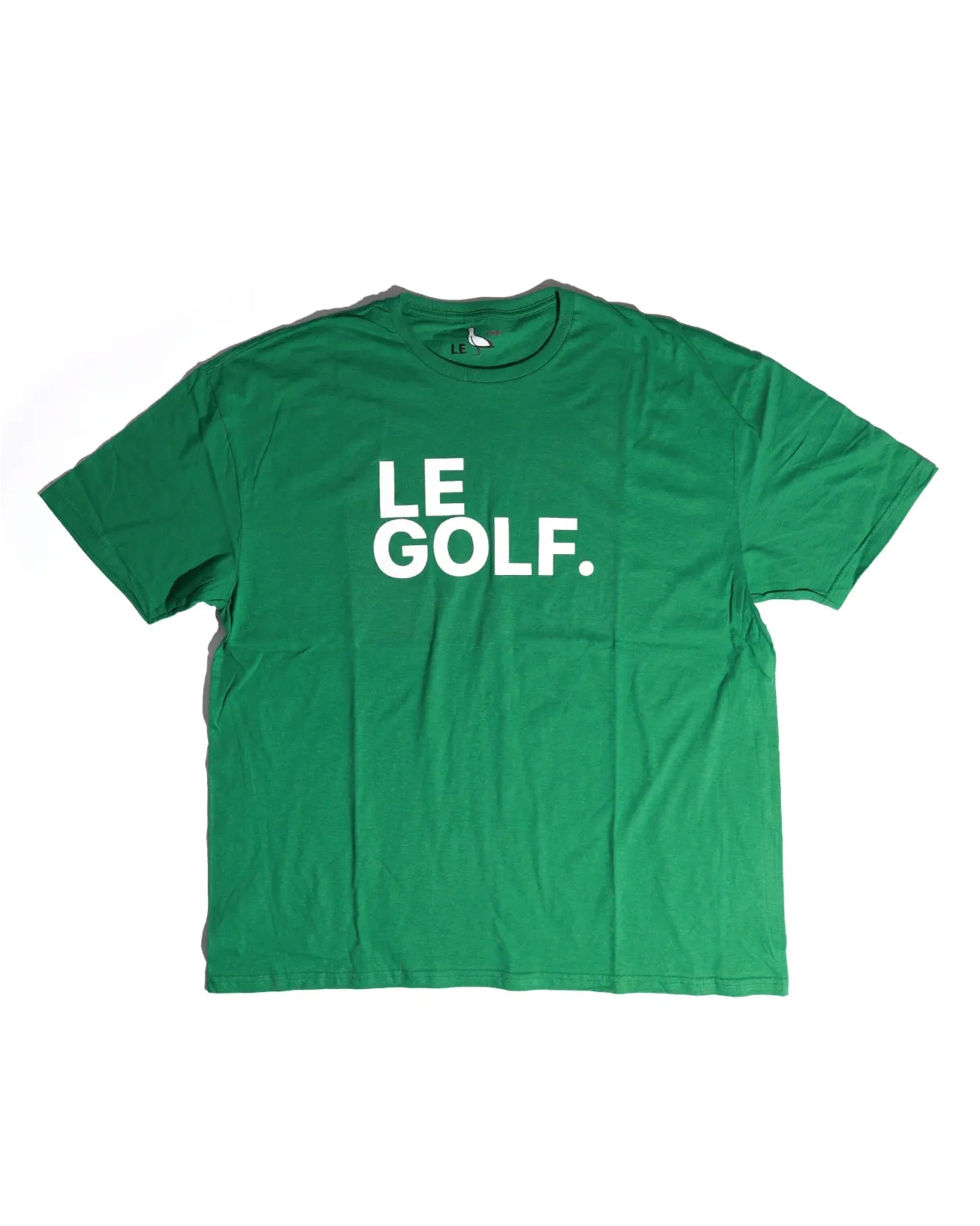 The Le Golf Tee by Ping Pong Surf Club is a grass green crew t-shirt made from soft ring spun cotton, featuring "LE GOLF." in bold white capitals on the chest.