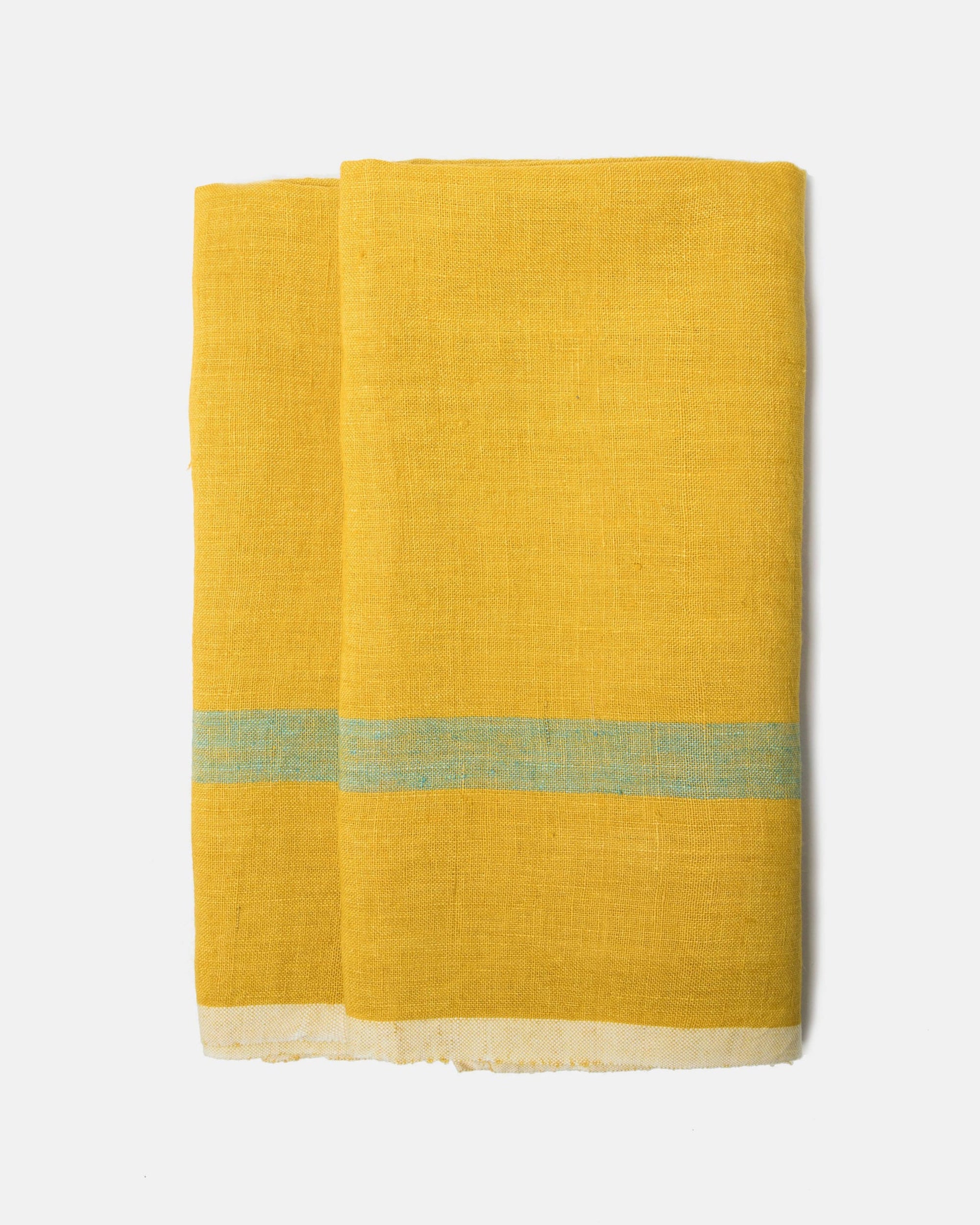 The Laundered Linen Towel Set-2 features two folded yellow stonewashed linen towels with a horizontal light blue stripe and thin white border at the bottom, displayed on a plain white background—ideal for vintage-inspired decor.