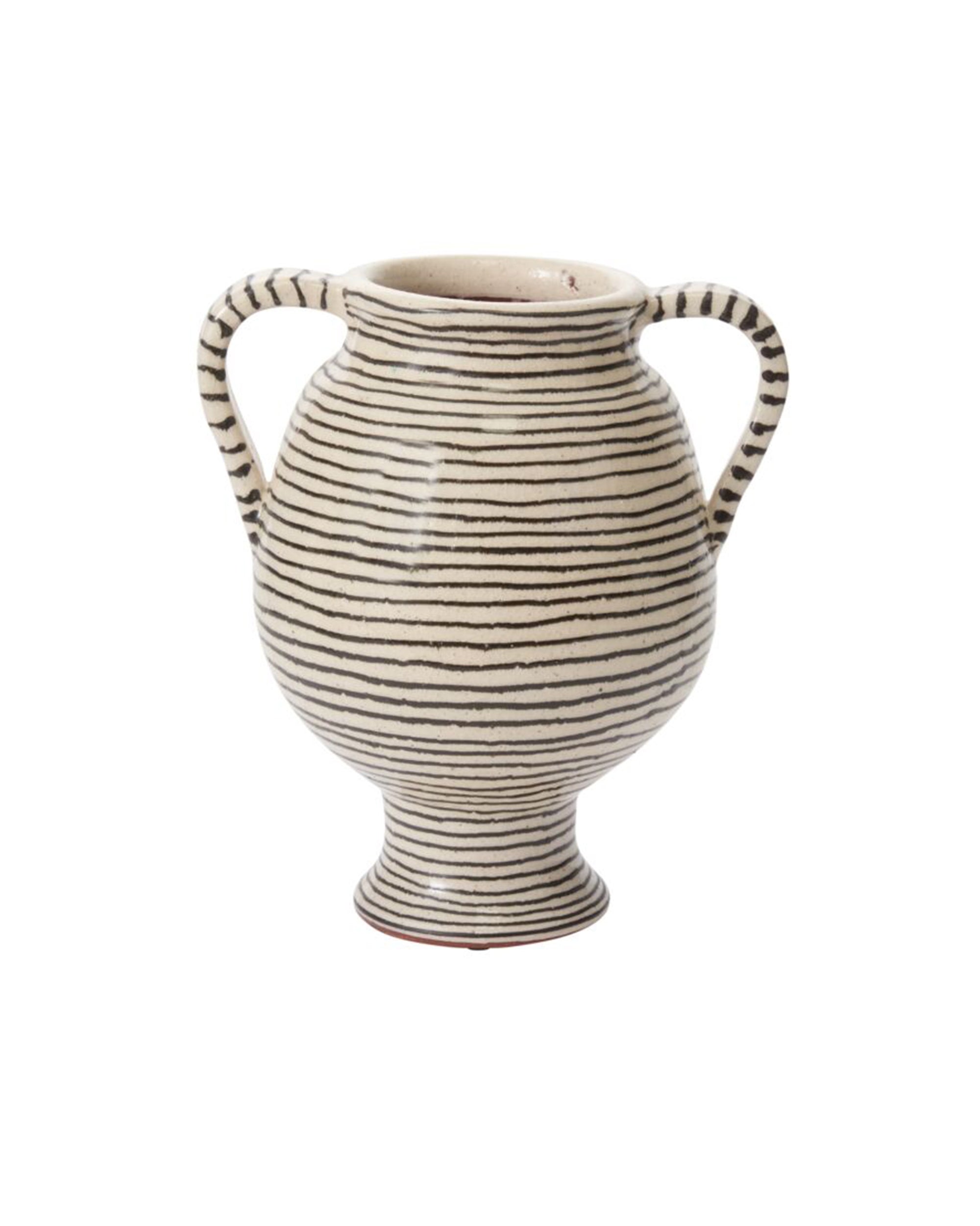 The Accent Decor 93775 Lines Vase is a cream-striped ceramic piece with two handles, a rounded body, small base, and wide mouth. Handcrafted with evenly spaced horizontal black stripes for a striking decorative display.