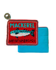 The Beaded Sardine Tin Coin Purse by Faire, featuring a sardine tin design with red accents, is displayed on a folded turquoise cloth.