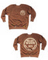 Two images of the Made Worn Madeworn Shrunken Sweatshirt, a brown USA-made crewneck with paint splatters, a small circular "MADE WORN 1971 ARTIST TOUR" logo on the chest, and a larger version on the back.