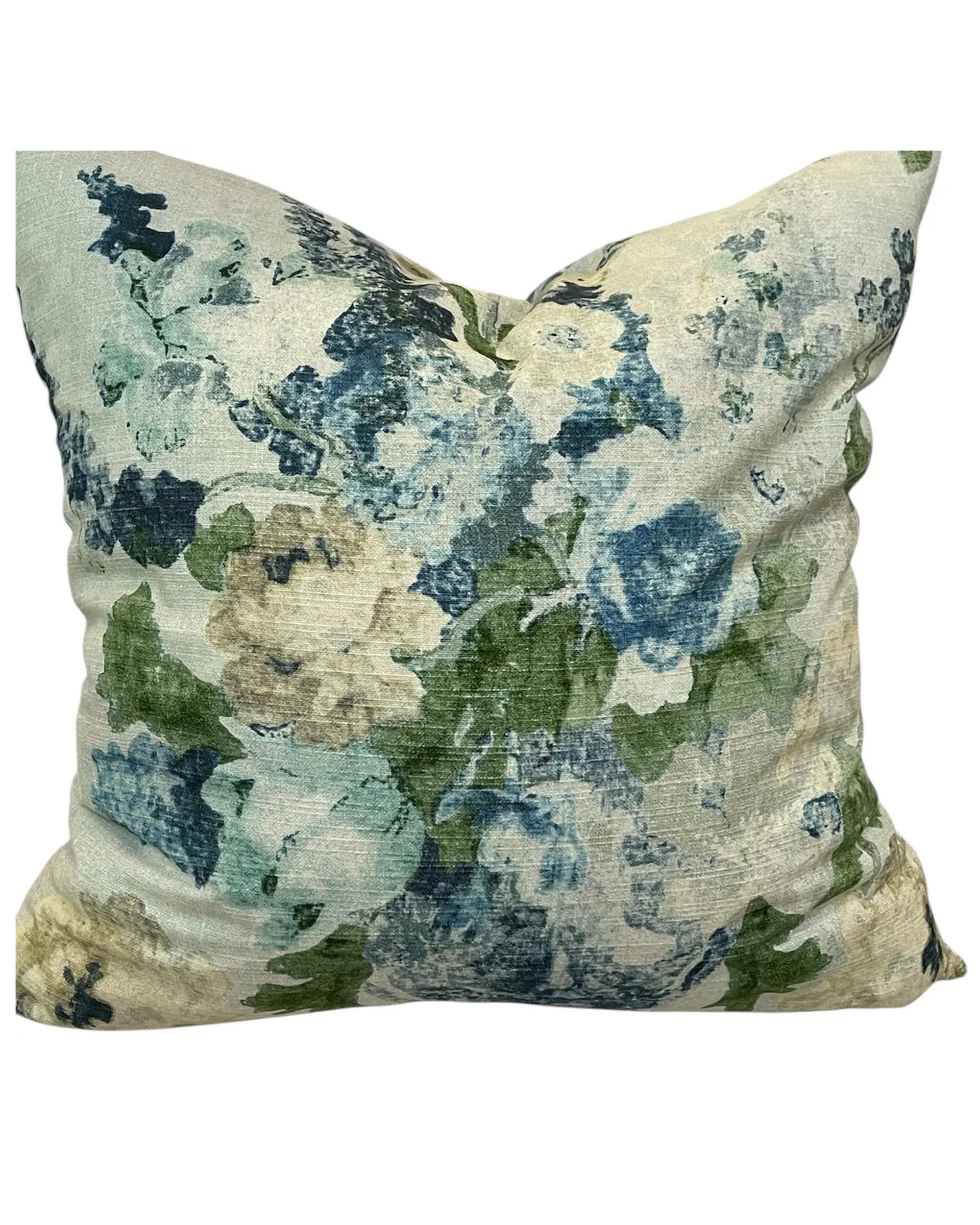 The Madison Floral 20x20 Pillow by Dahlia & Grace Pillows features soft cream cotton with a watercolor-style blue, green, and beige floral pattern, showcasing abstract flower shapes inspired by classic blue and white vase designs.