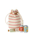 The Maileg Bag W/ Beach Essentials includes a striped tote with red lines behind a mini bottle and two cans labeled "Coca-Cola" and "Sparkling Water" (with lemon slices)—adorable, mouse-sized items perfect for a beach day.