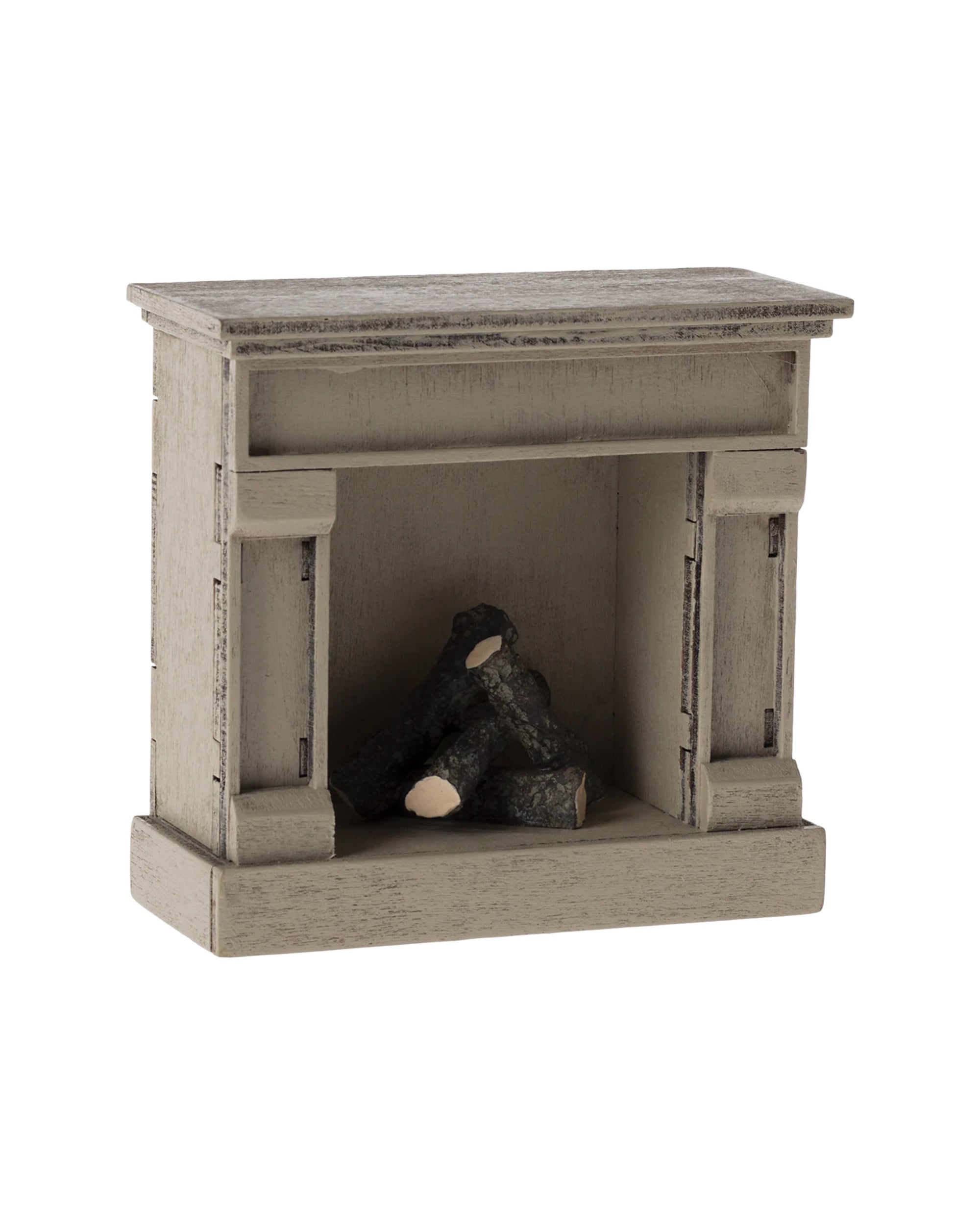 The Maileg Fireplace by Maileg is a small, decorative wooden miniature with a vintage finish and three faux logs—ideal as a cozy accent for any mouse home.