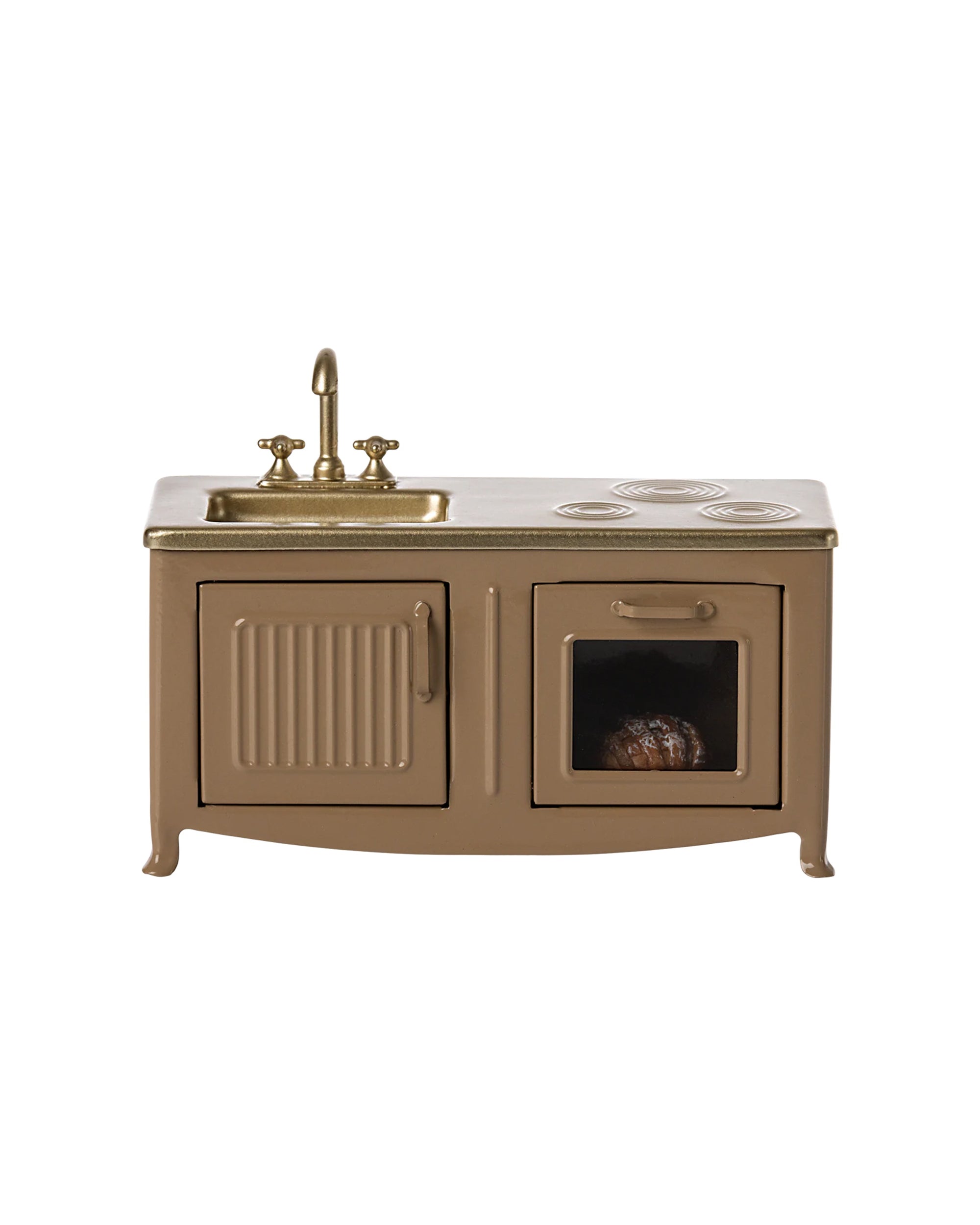 The Maileg Kitchen by Maileg is a small brown miniature set featuring a sink, faucet, two stove burners, cabinet, and oven with a loaf of bread, displayed on a white background.