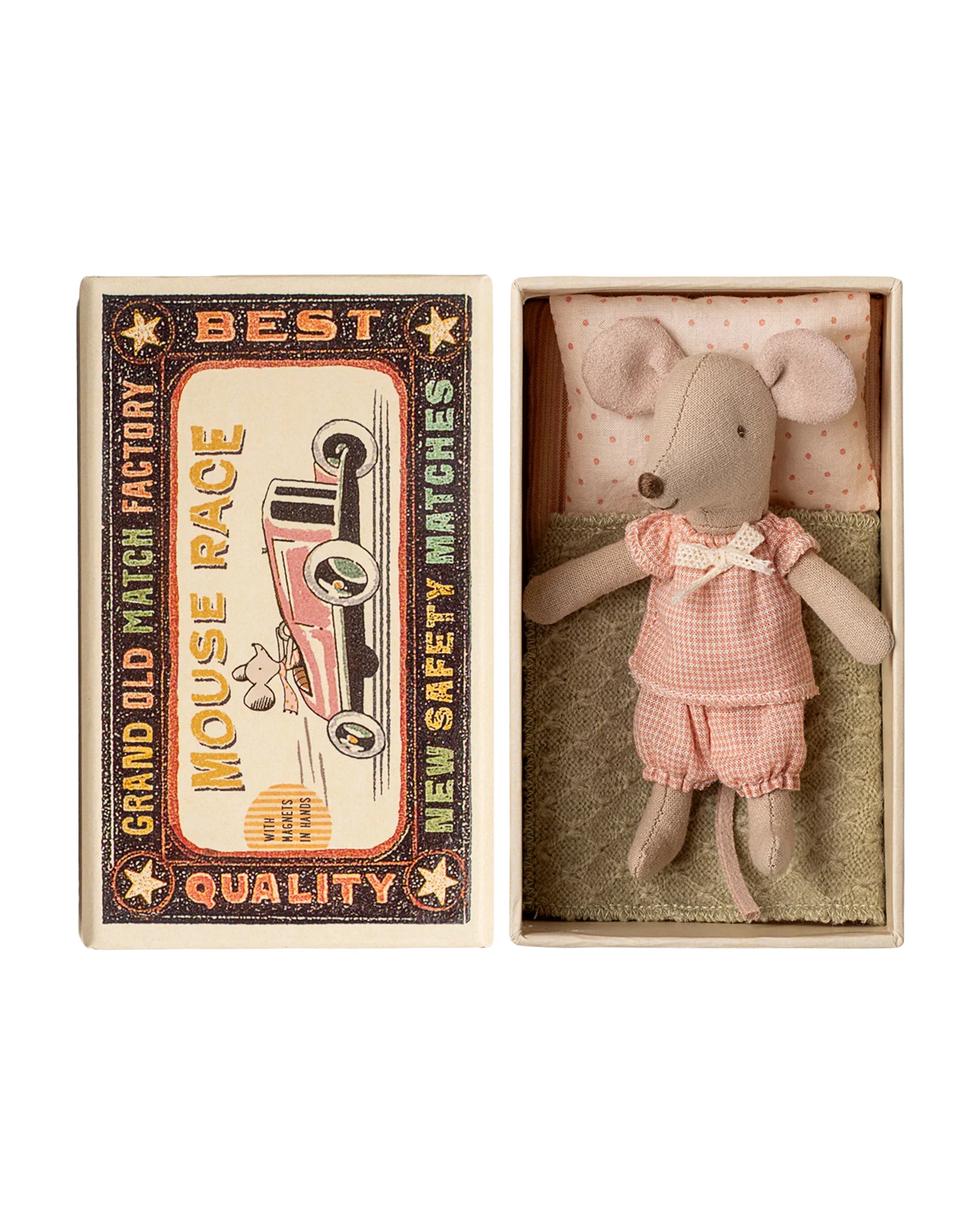 The Maileg Little Sister Mouse by Maileg wears pink gingham pajamas and lies on a blanket in an open matchbox. The box lid features a vintage race car and the words “Mouse Race” and “Best Quality.”.