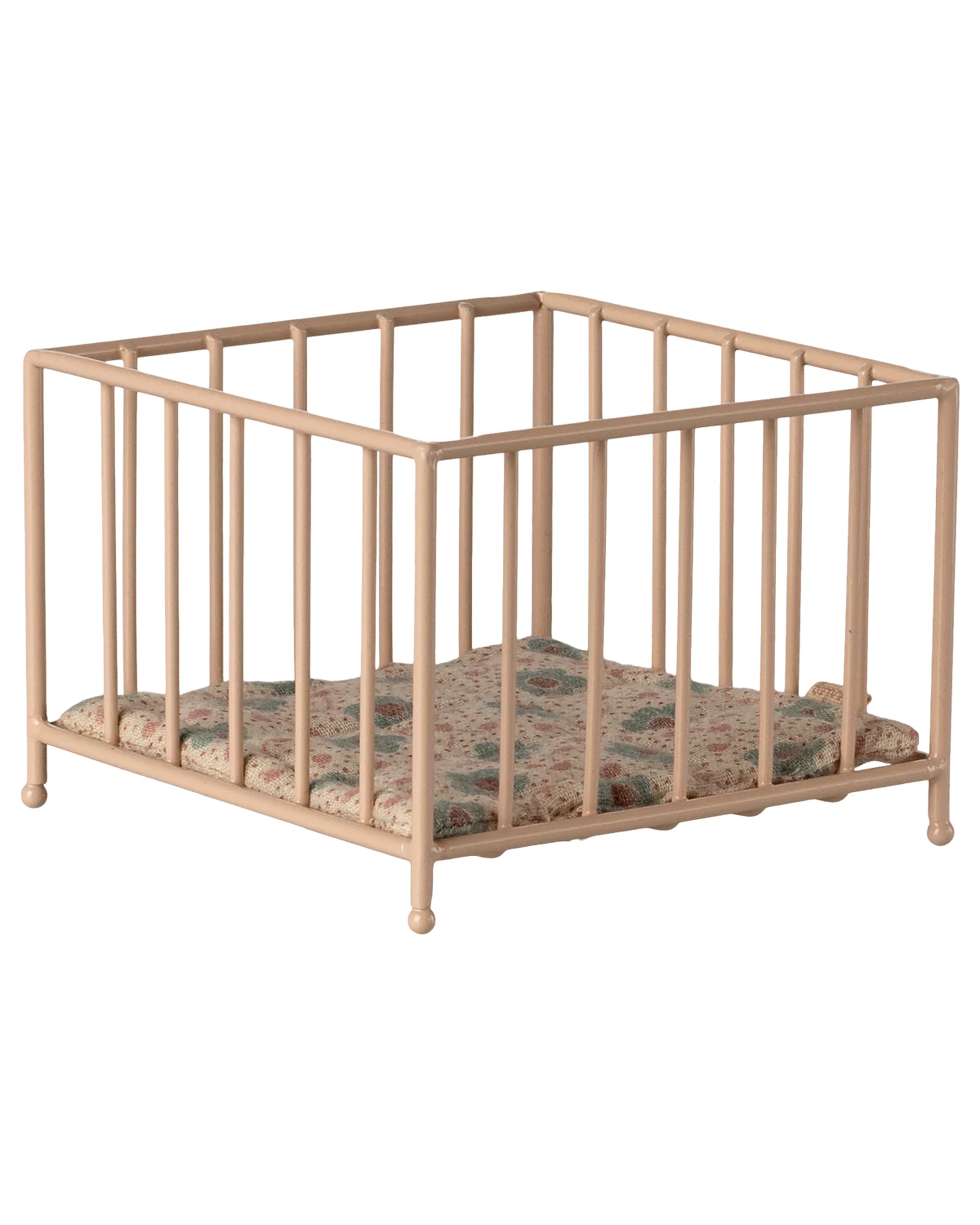 The Maileg Playpen, My - Rose is a small beige playpen with vertical bars and a floral-patterned cushioned mat inside, displayed on a white background.