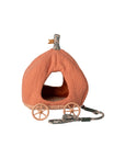 The Maileg Pumpkin Carriage by Maileg is an orange, pumpkin-shaped pet bed with a fabric stem, two small wheels on each side, and an attached leash—resembling a fairytale royal mice carriage.