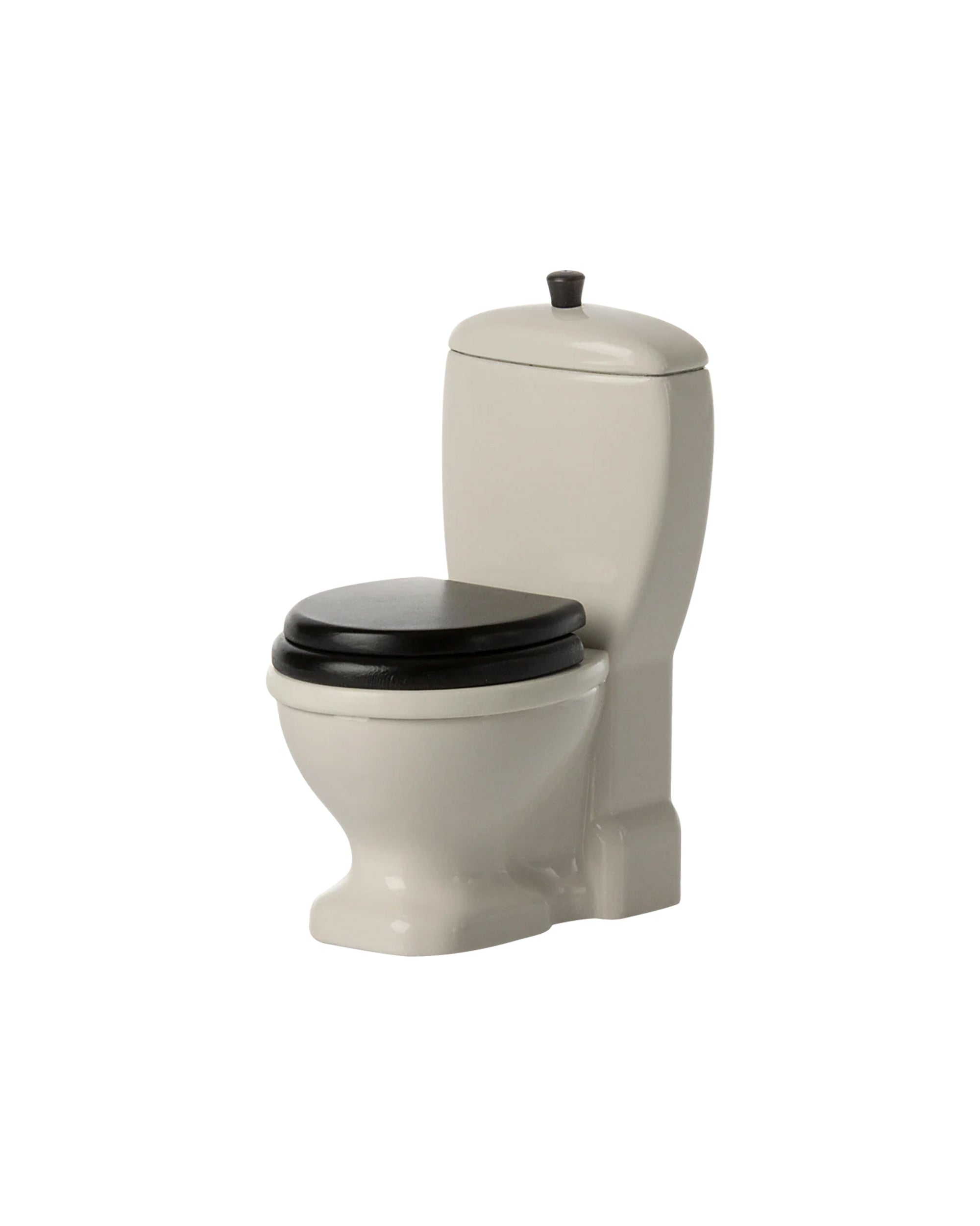 The Maileg Toilet by Maileg is a small beige toy toilet with a black seat and lid, designed for toy mice. With its classic round bowl and water tank, it’s perfect for imaginative play, shown isolated on a white background.