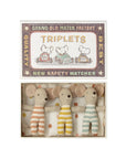 The Maileg Triplet Mice by Maileg features three baby mice in striped orange, yellow, and green outfits cuddled together side by side in a cozy bed inside their box.