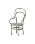 The Maileg Vintage Chair by Maileg is a small, light green wooden chair with a curved backrest, rounded armrests, and a woven seat—perfect for mice furniture or dollhouse accessories and shown on a white background.