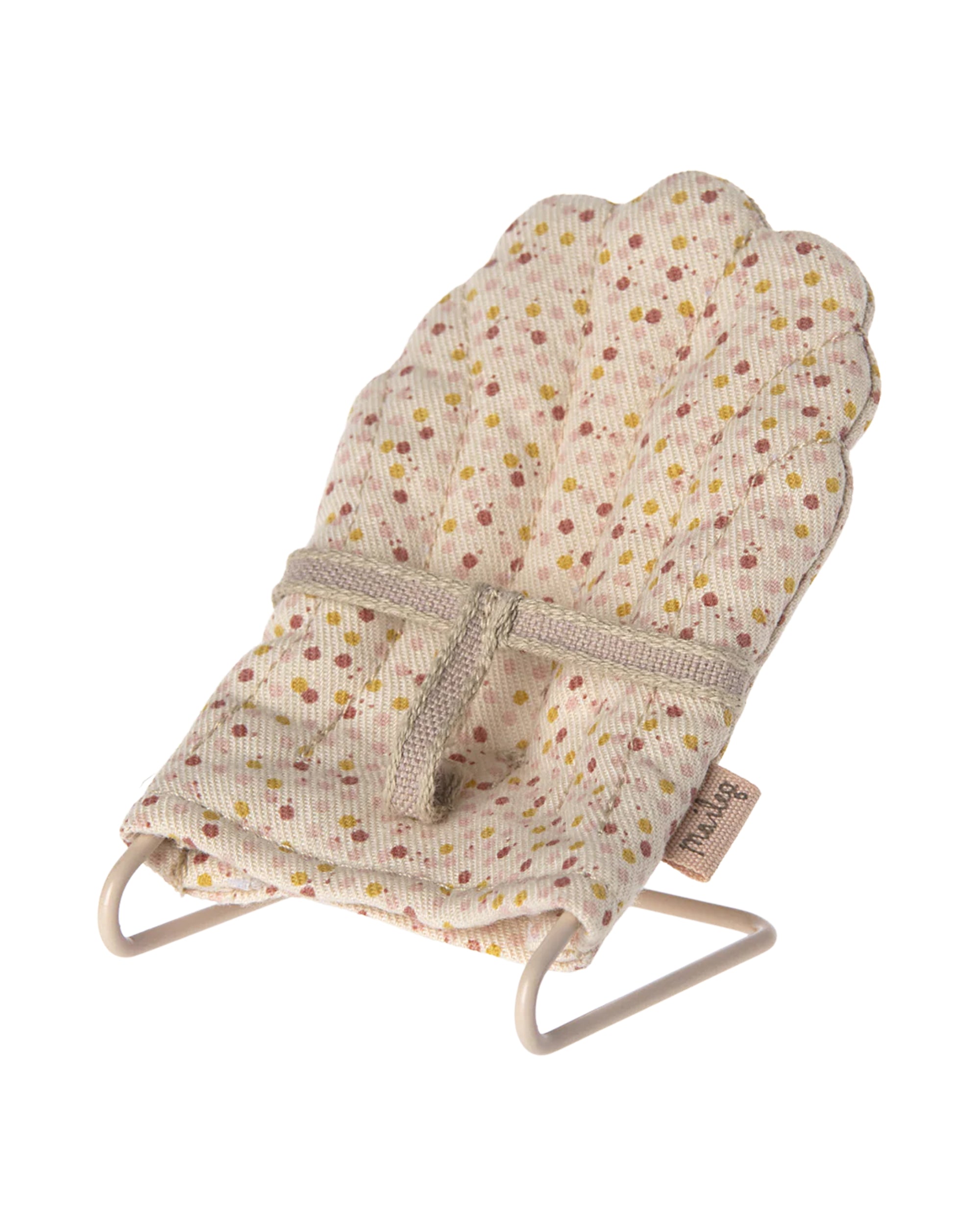 The Maileg My Babysitter by Maileg is a small doll chair with a scalloped backrest, light beige fabric featuring a pink and yellow floral pattern, and a simple metal base.