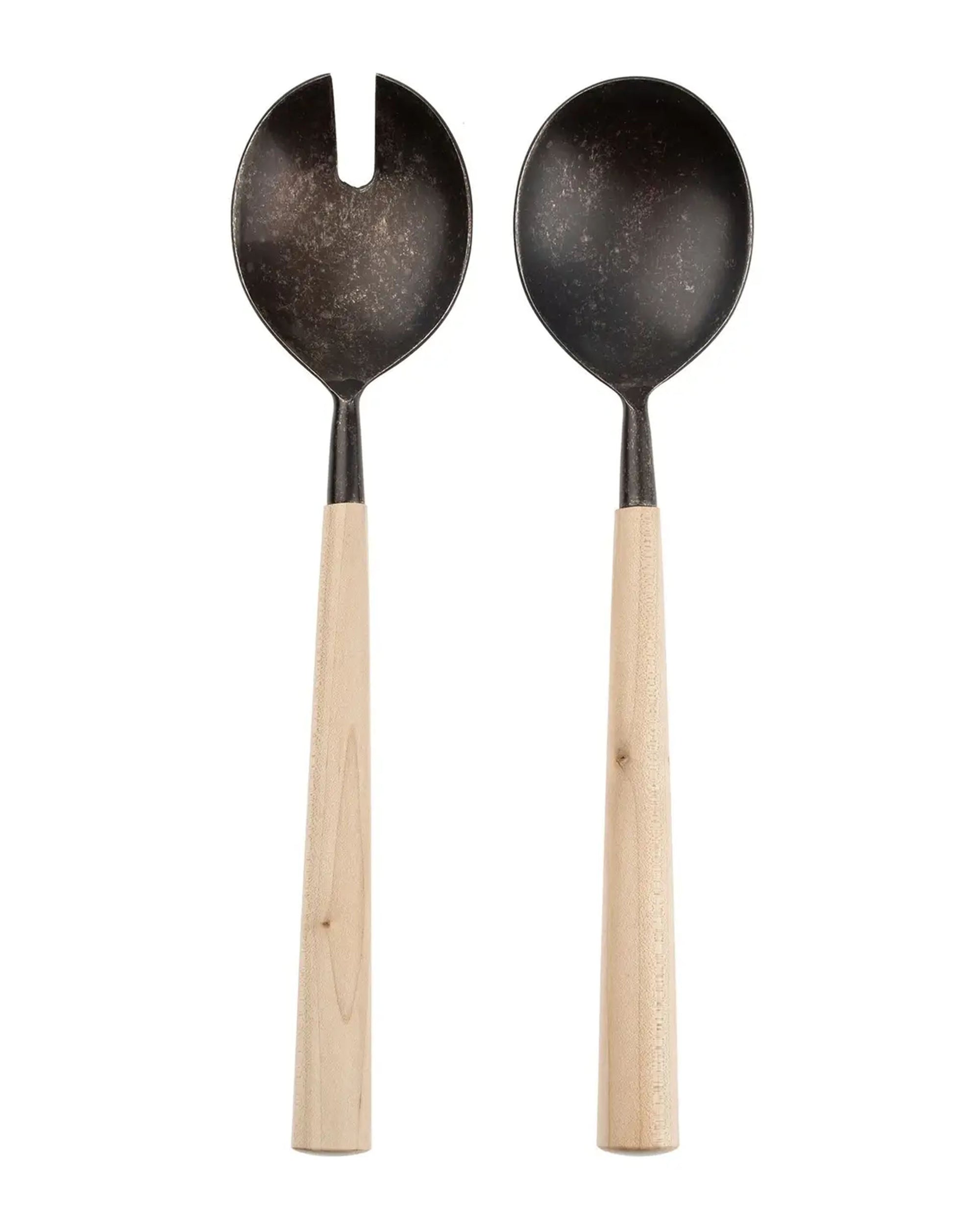The Indaba Maple Salad Servers feature dark metal heads and light maple wood handles—one spoon, one fork with a notch—in a simple, rustic design. Perfect as unique hostess gifts for gatherings.