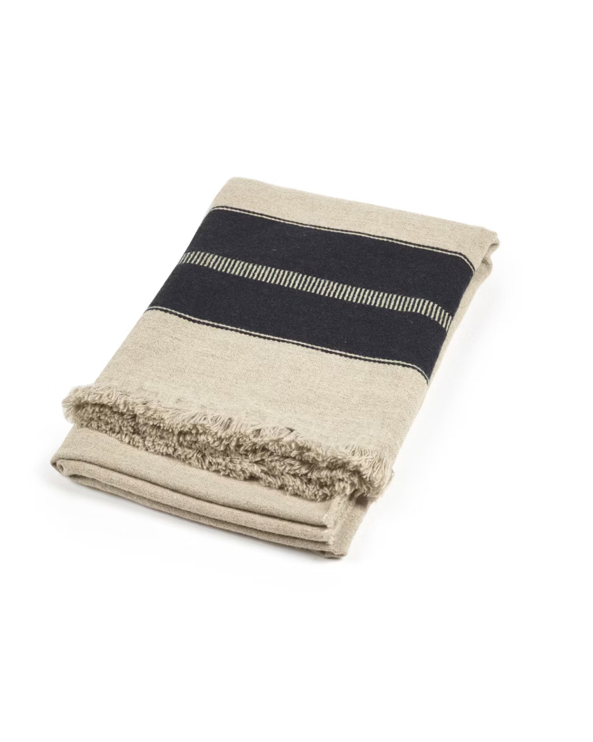 The Marshall Throw by Libeco Home is a folded beige wool blanket featuring a wide black stripe and flax fringe on one edge, displayed against a white background.