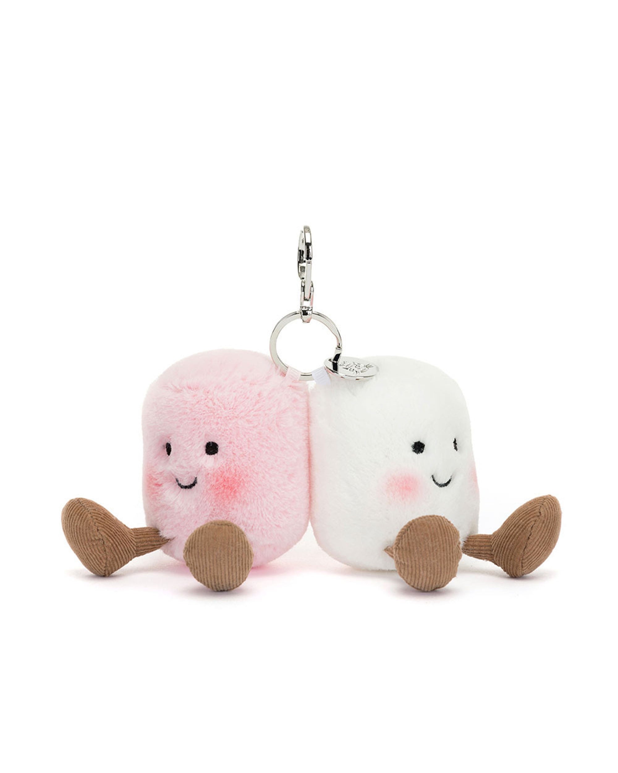 Two Jelly Cat Inc. Marshmallow Bag Charms—one pink, one white—sit side by side with smiling faces, blush cheeks, and brown legs, connected by a metal keyring.