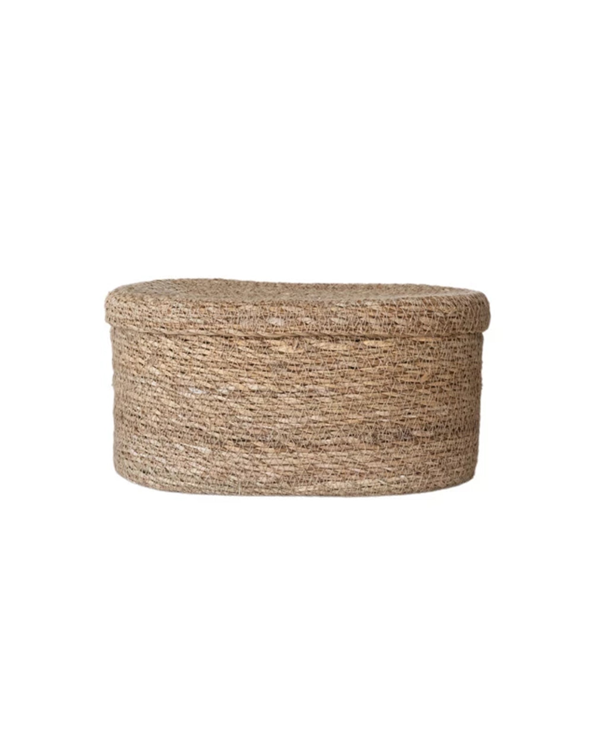 The Creative Co-op Sea Grass Basket (Long Oval) is a hand-woven, light brown storage basket with a matching lid—ideal for organizing household items—displayed on a plain white background.