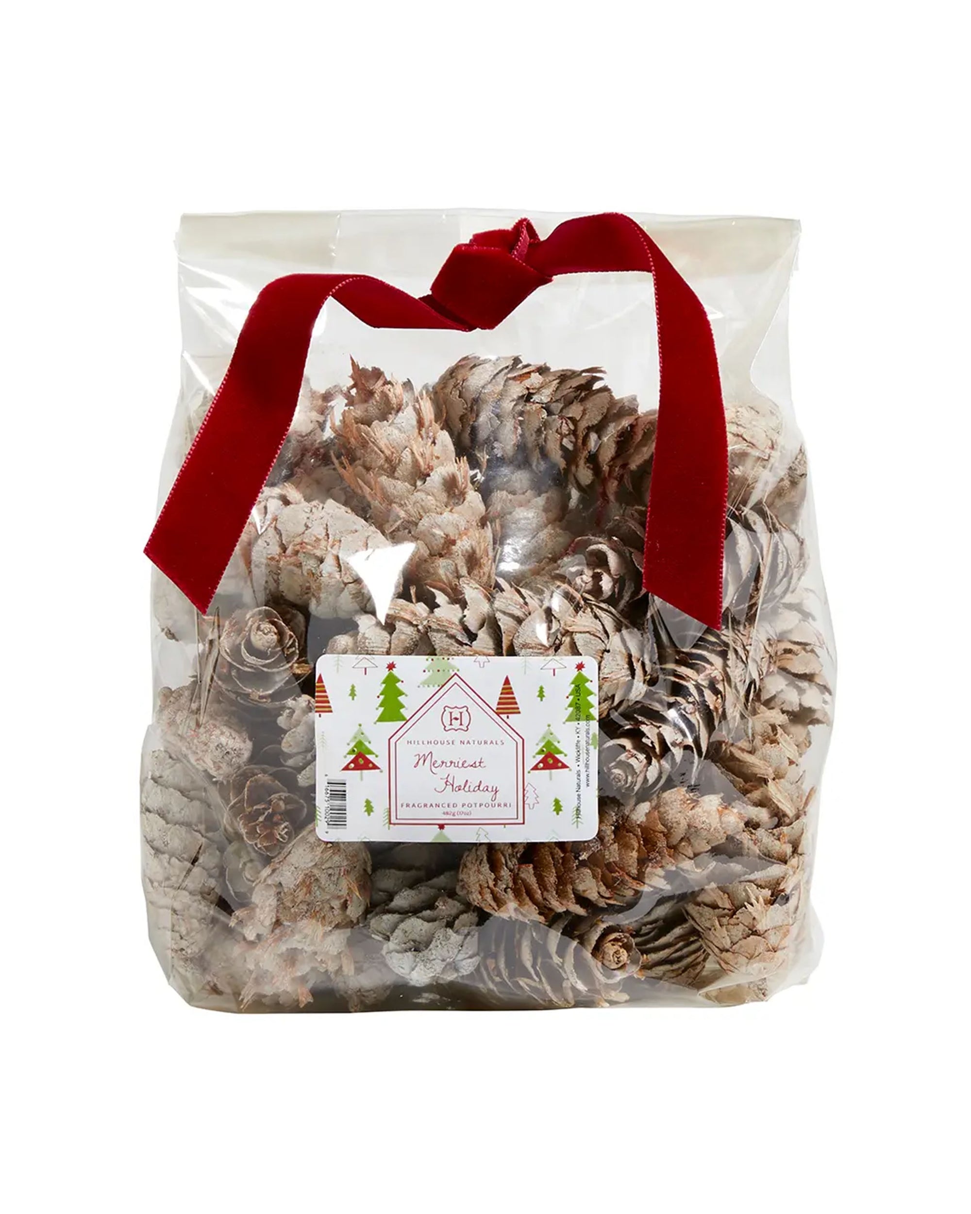 A clear bag of Faire Christmas Potpourri White Cones, tied with a red velvet ribbon and festive label featuring holiday trees. The cones offer a hint of eucalyptus and woody fragrance for the holidays.