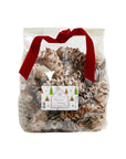 A clear bag of Faire Christmas Potpourri White Cones, tied with a red velvet ribbon and festive label featuring holiday trees. The cones offer a hint of eucalyptus and woody fragrance for the holidays.