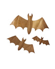 Accent Decor’s Bat Wall Art features three gold bat-shaped accents with outstretched wings, displayed on a white background—ideal as striking Halloween décor or for creating a dramatic winged bat garland effect.