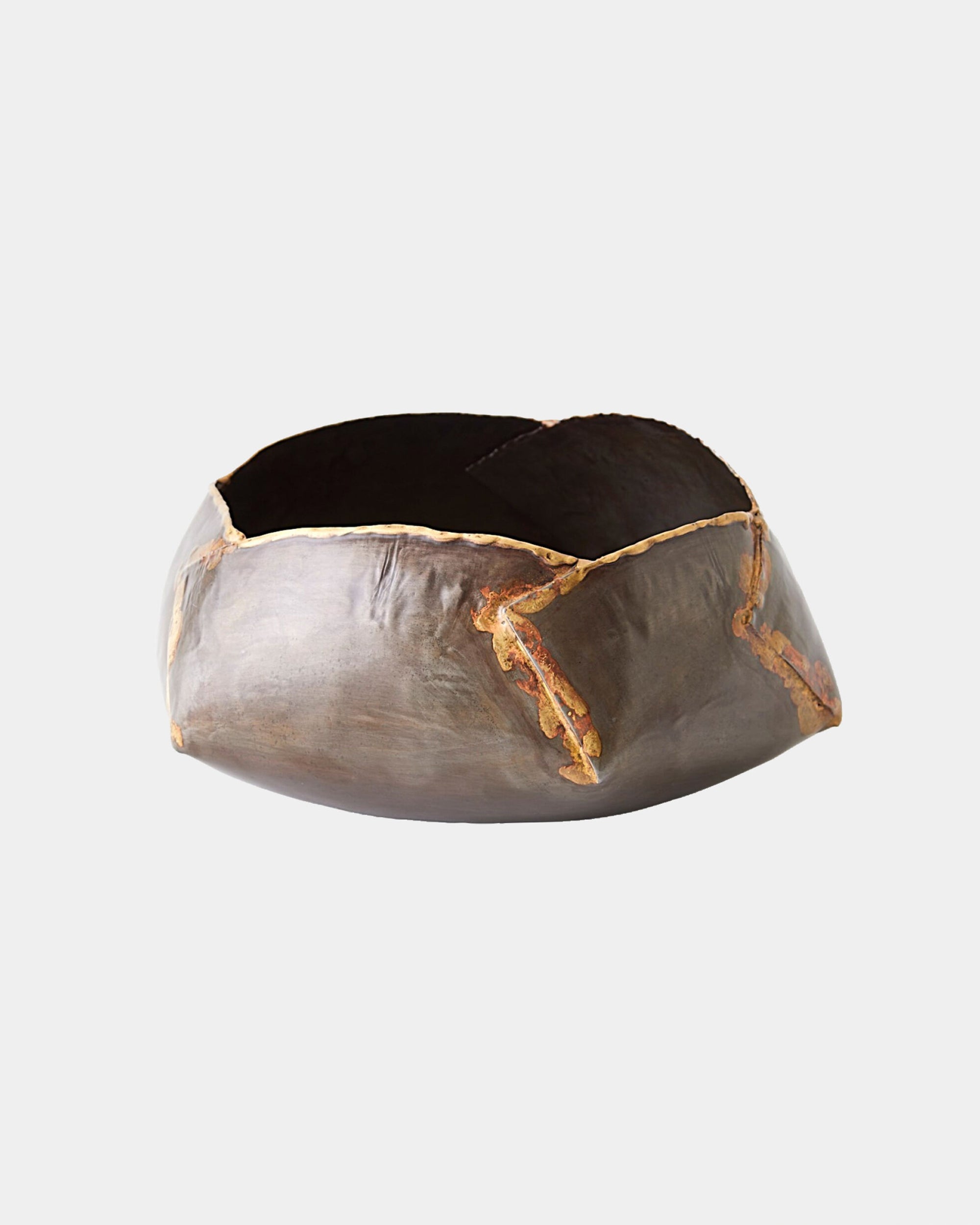 The Pleated Armor Bowl M by Global Views is a round, dark ceramic bowl with a gunmetal finish and golden kintsugi-style cracks, shown against a plain white background.