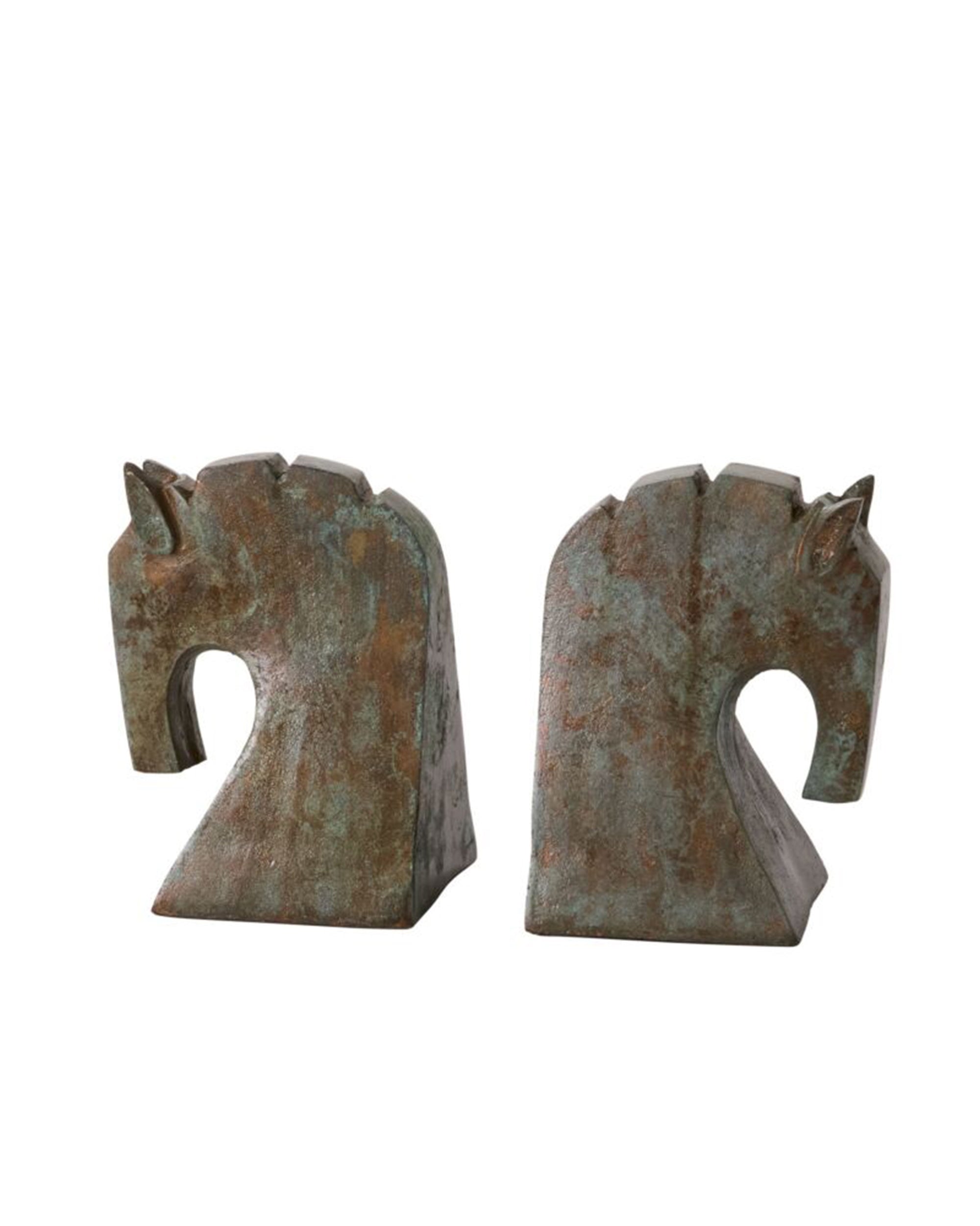 Accent Decor’s Equina Bookend S/2 features two rustic, patina-finished horse head bookends in opposite directions, offering a vintage midcentury touch and unique character to your home decor.