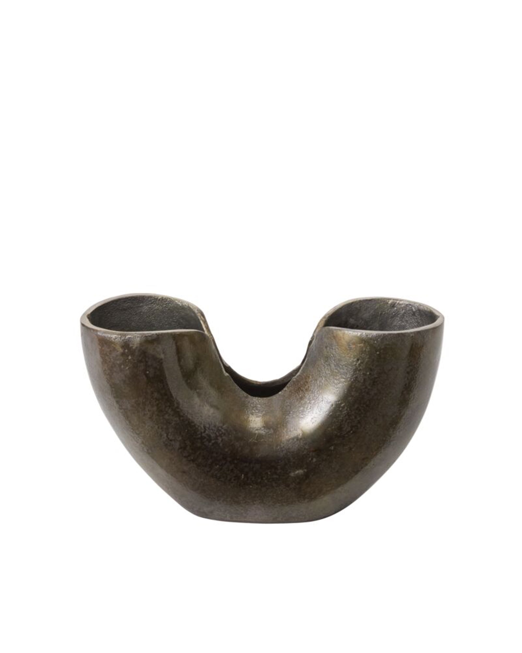 The 74705 Franz Vase by Accent Decor features a dark, metallic, sculptural design with a wide rounded base, two upward-facing sections divided by a central dip, and a textured, slightly reflective oxidized surface.