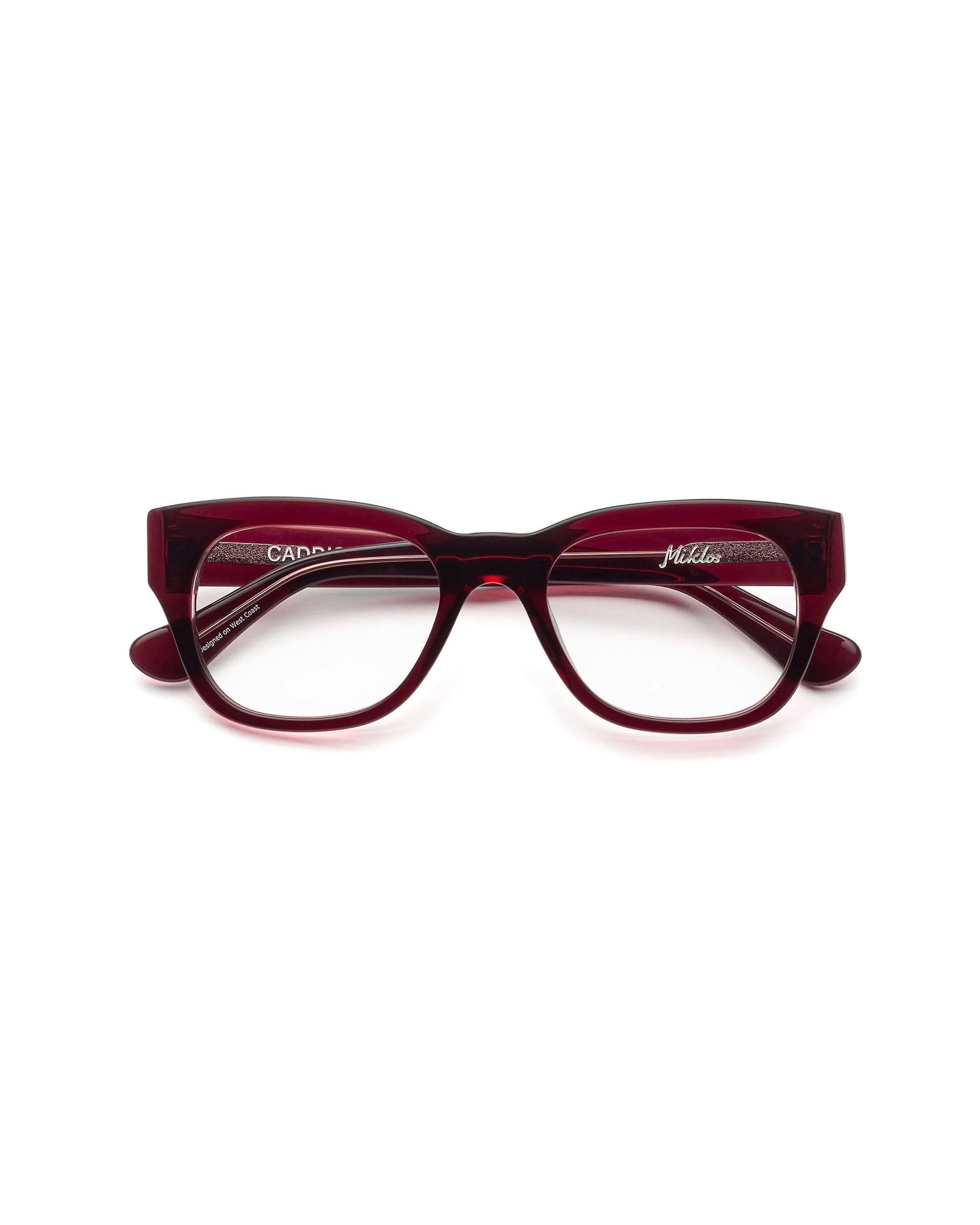 A pair of Caddis Miklos Boxwine rectangular eyeglasses with a thick, red frame, shown facing forward on a white background.