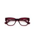 A pair of Caddis Miklos Boxwine rectangular eyeglasses with a thick, red frame, shown facing forward on a white background.
