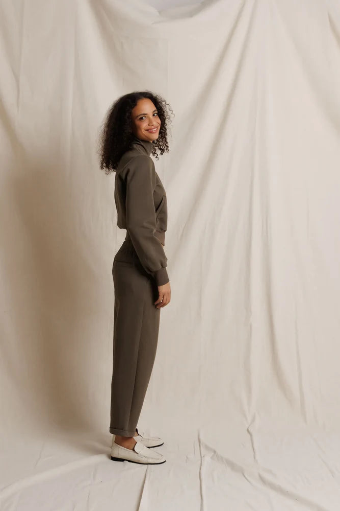 Perfectwhitetee Milana Track Jacket in beige, modeled by a smiling woman with curly hair against a neutral background.