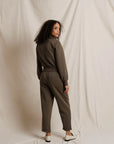 Milana Track Jacket by Perfectwhitetee in cream, shown on model looking over her shoulder against a neutral backdrop.