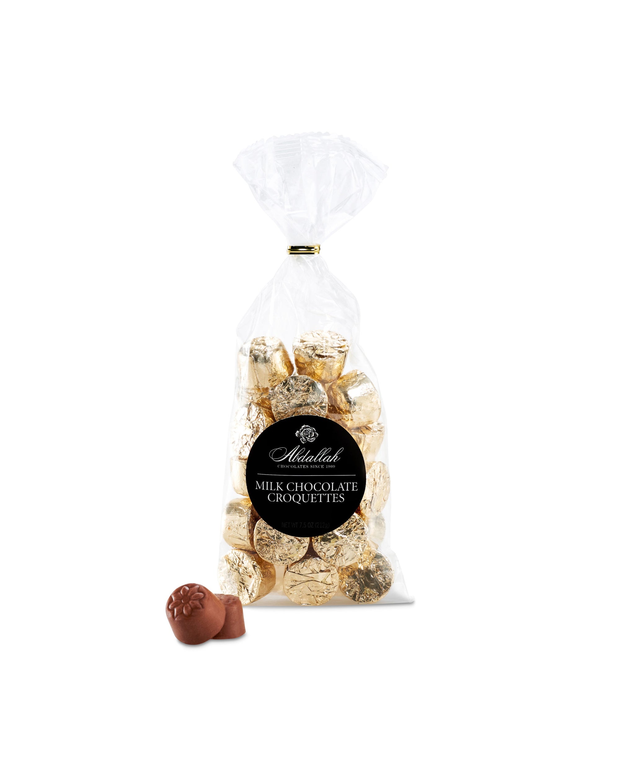 A clear bag of Abdallah Milk Chocolate Croquettes, filled with gold-foiled, gluten-free milk chocolate pieces, is shown on a white background with two unwrapped chocolates in front.