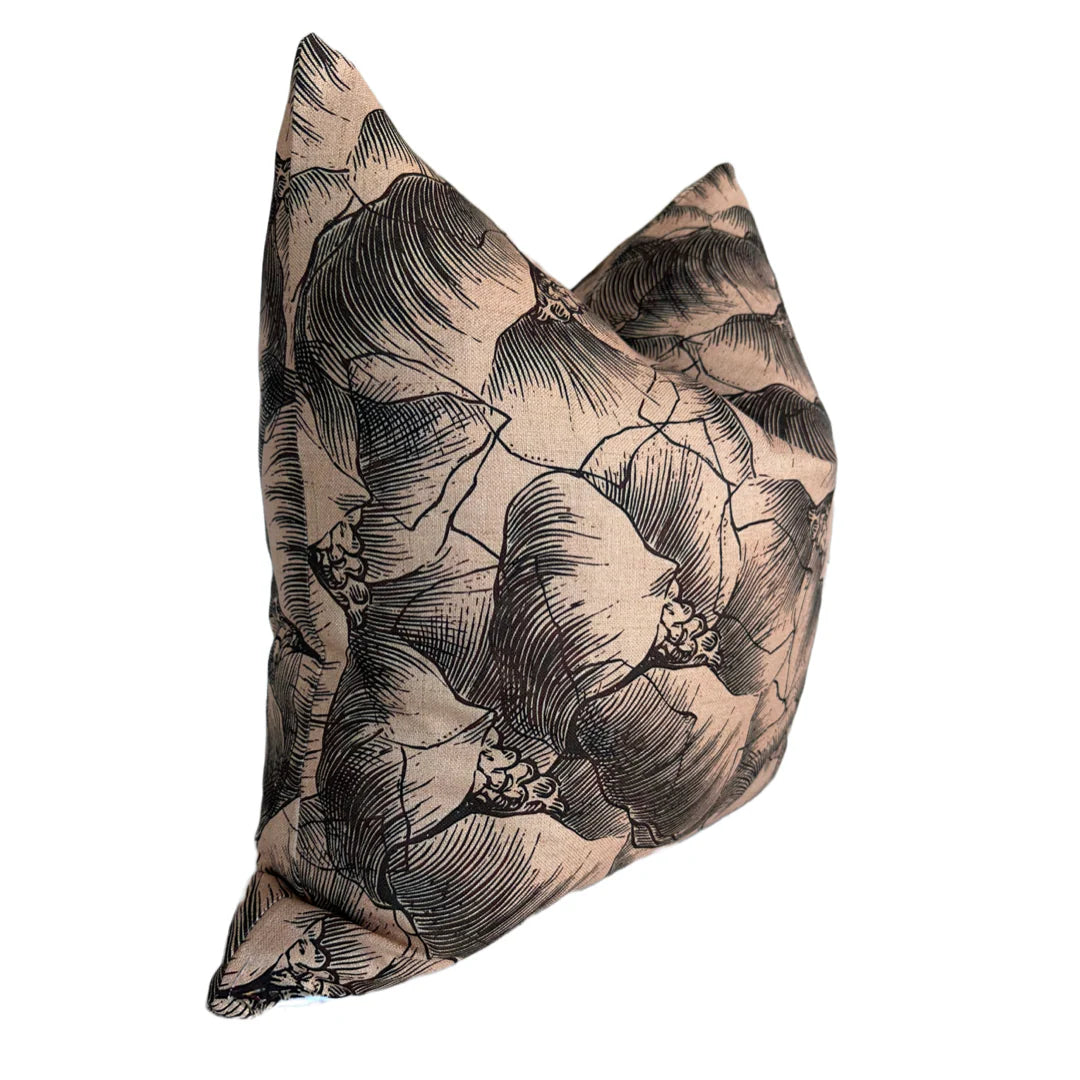 The Rennah Collective Milo Pillow 22x22 features a beige background with black floral line art on a plush polyester-linen blend, showcasing large, overlapping petals for a modern touch to any space.