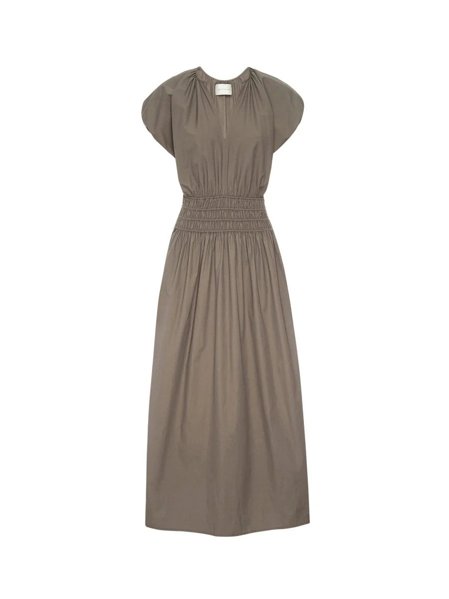 The BROCHU WALKER MINA DRESS is a taupe short-sleeve dress featuring a smocked waist and gathered shoulder detailing, shown against a plain white background.