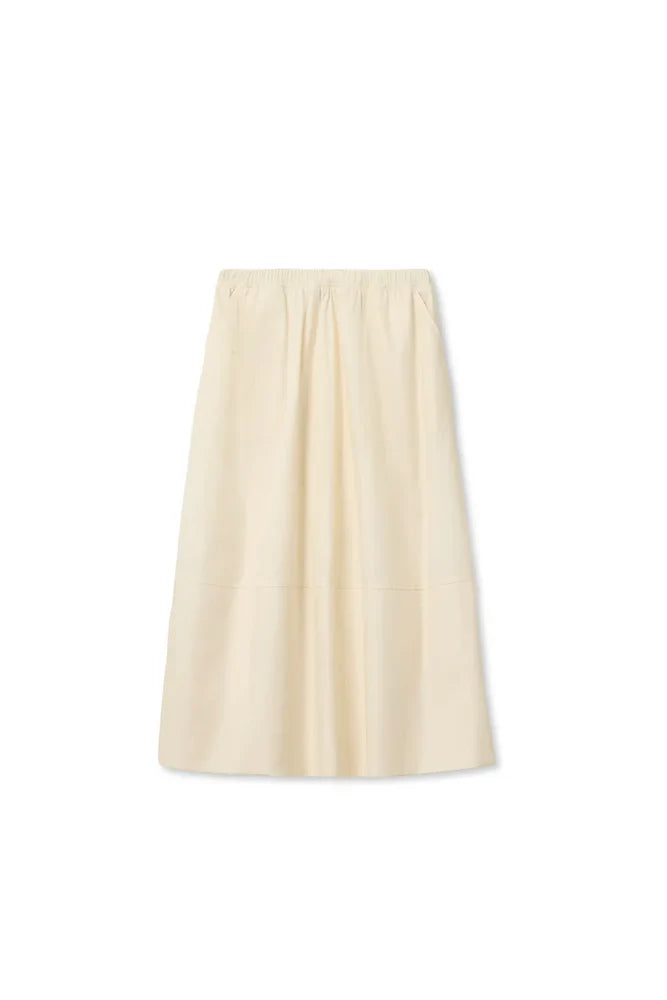 The Poplin A Line Skirt by Perfectwhitetee is a cream-colored, knee-length cotton skirt featuring an elastic waistband, subtle pleats, and pockets, shown against a plain white background.