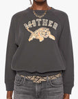 The Concert sweatshirt by Mother paired with cropped jeans and a snake-print belt for a casual, modern look.