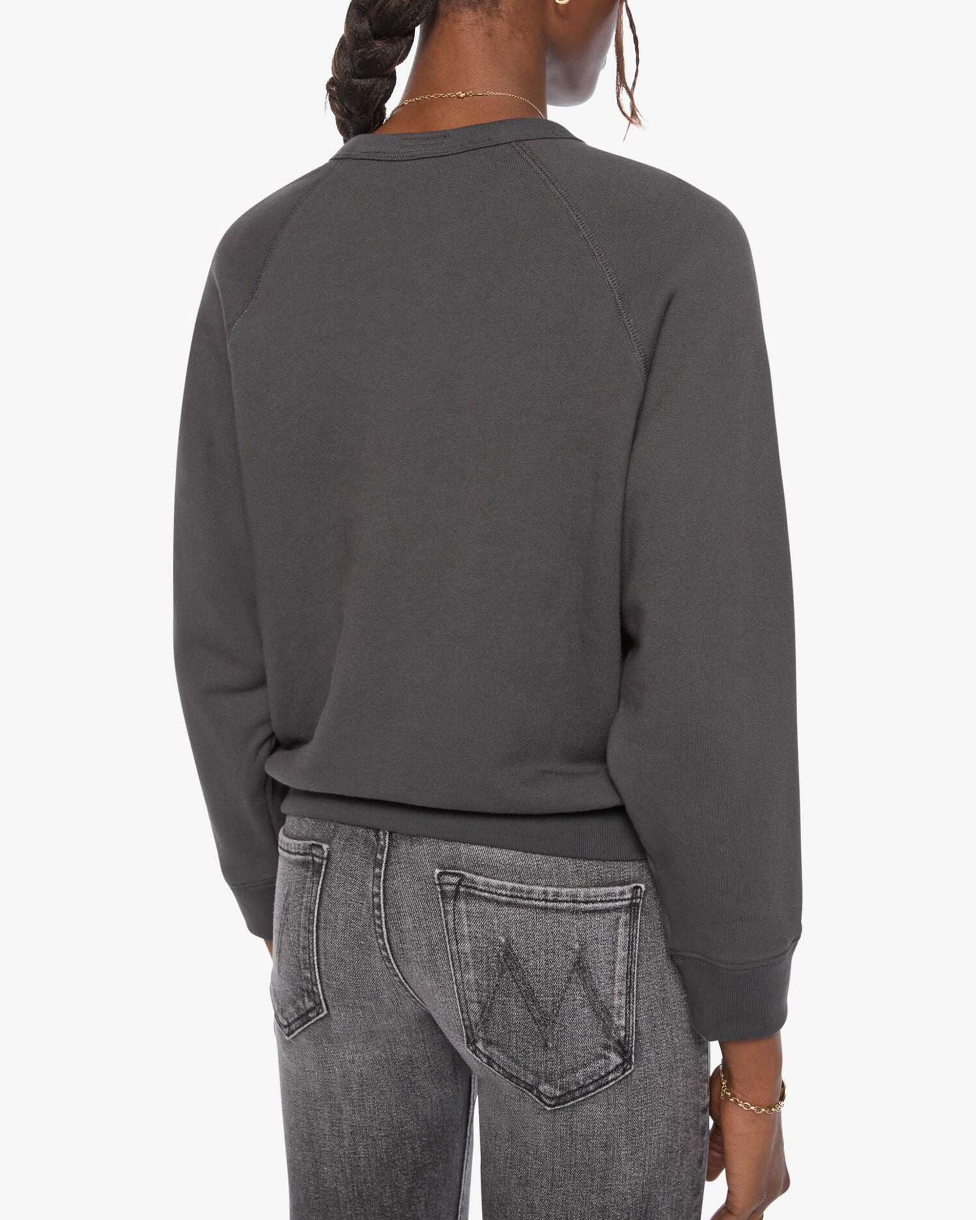Back view of The Concert shrunken raglan sweatshirt and faded black Mother jeans in black on white background.