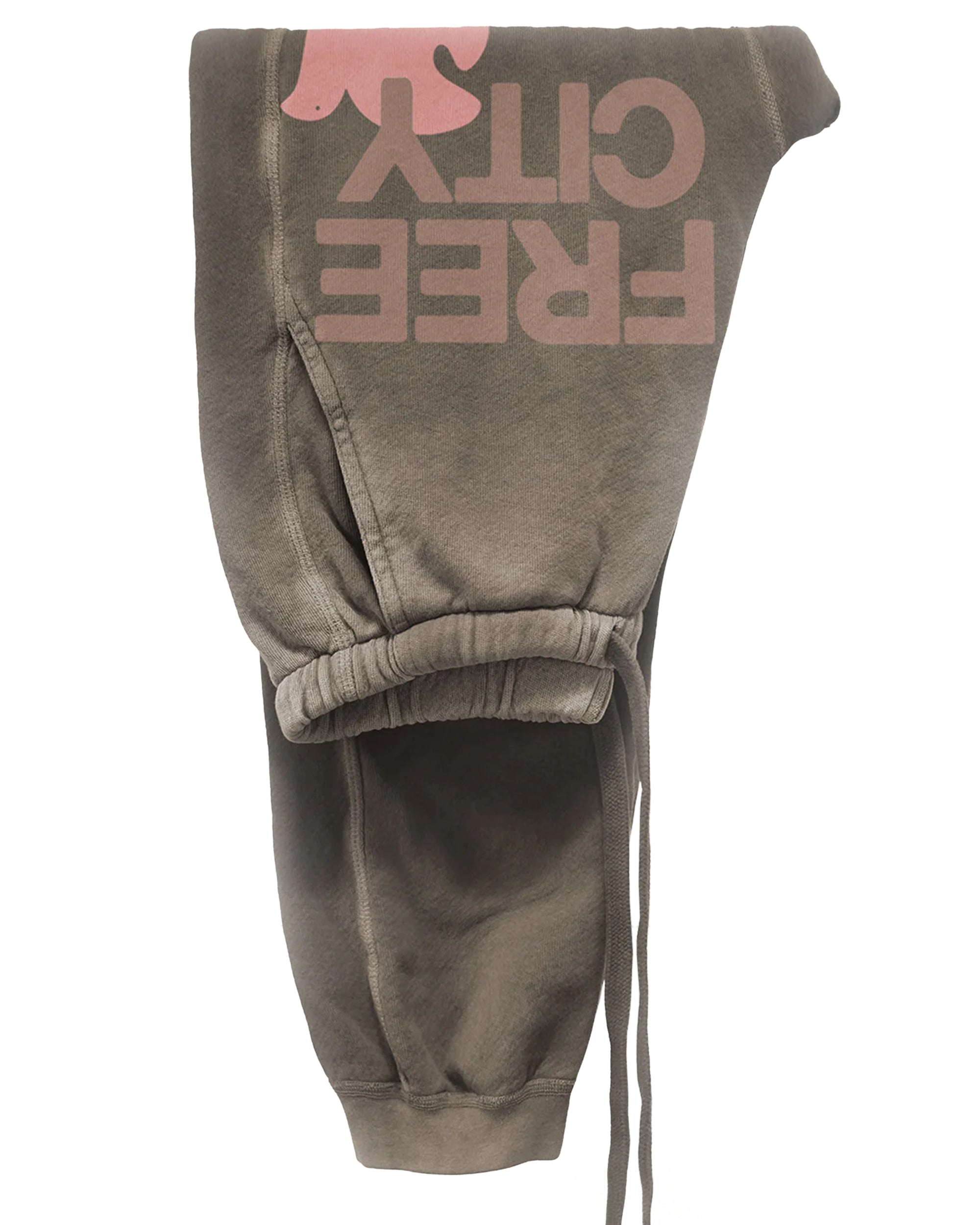 A pair of brown unisex FREECITY LARGE SUNFADES pocket sweatpants by Free City (sparrow, LLC), featuring "FREE CITY" and a pink dove print, shown folded and viewed upside down.